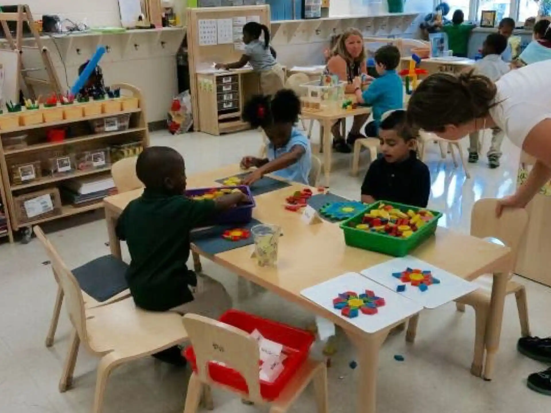 a person and children in a classroom