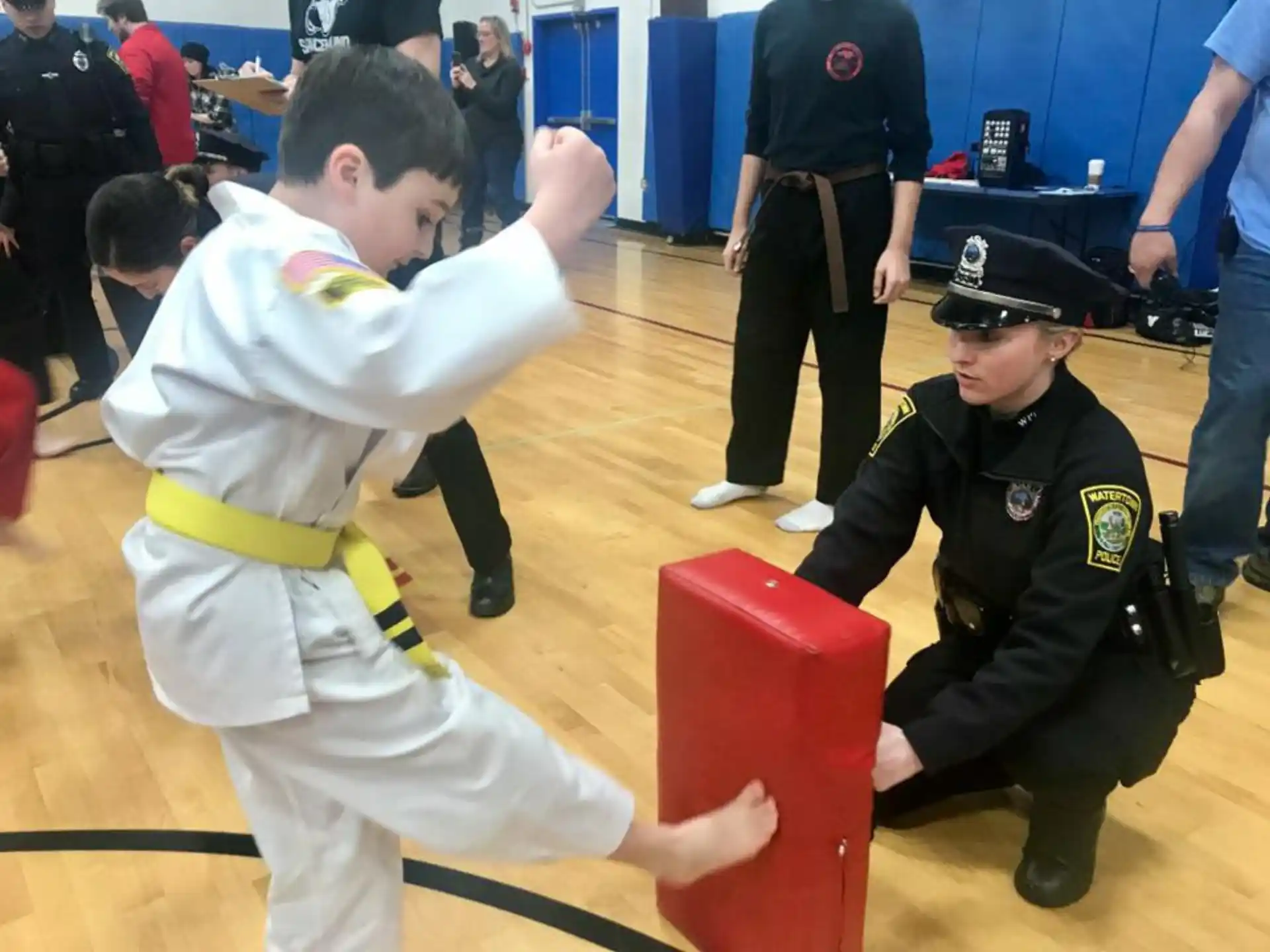 a person in a uniform kicking a person in a uniform