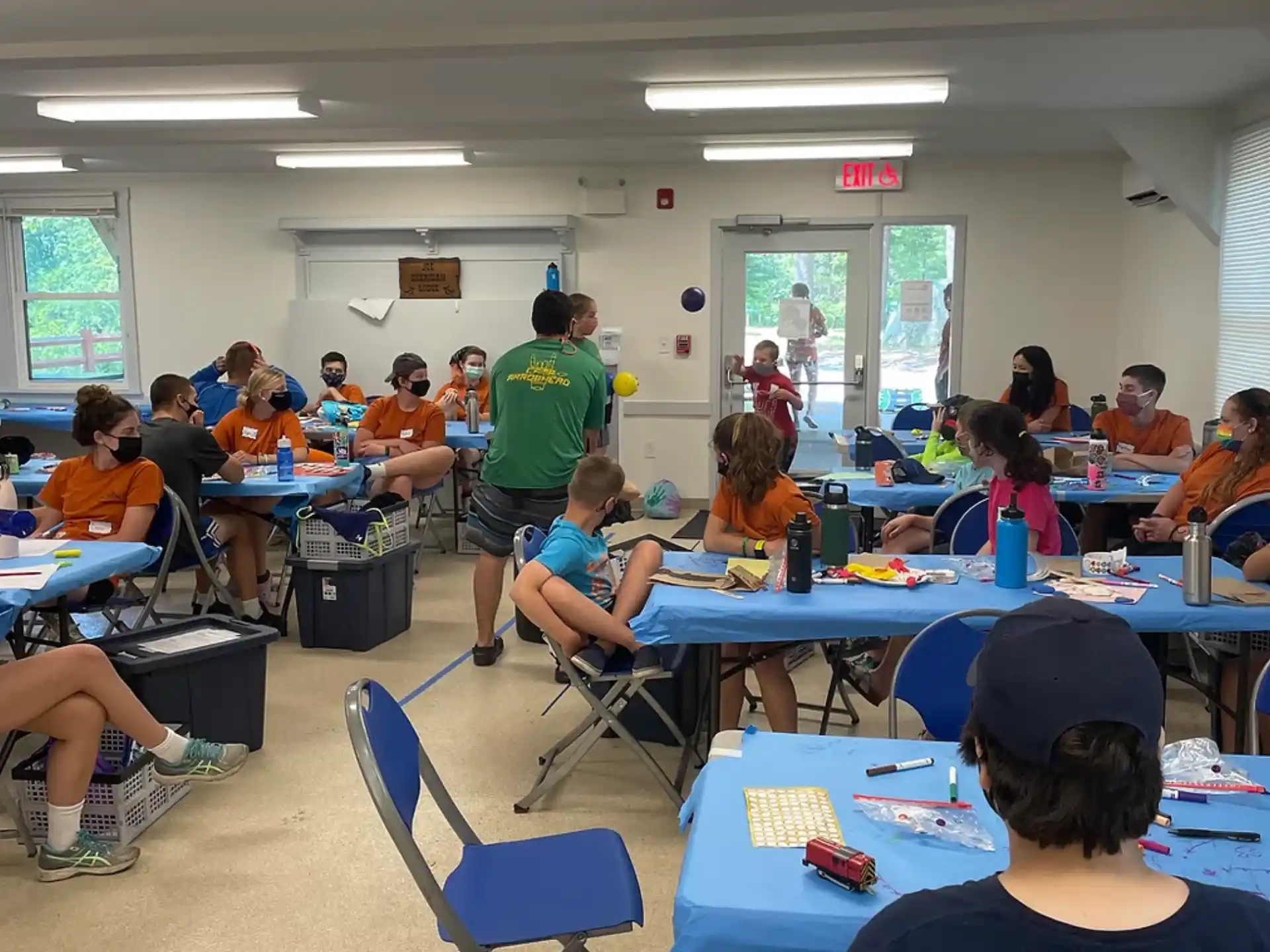 a group of people sitting at tables
