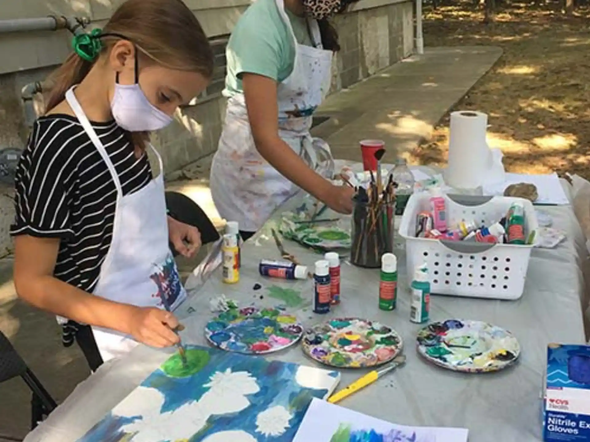 a group of people painting