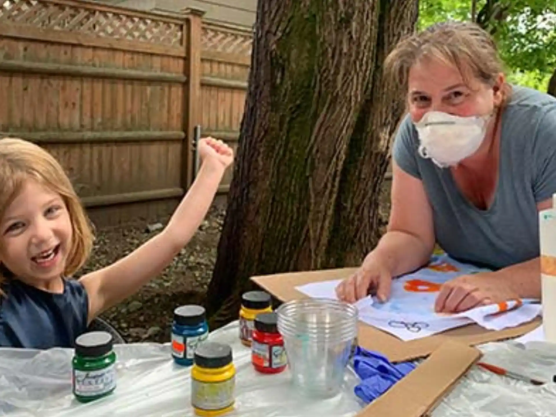 a person and a girl with paint on their faces