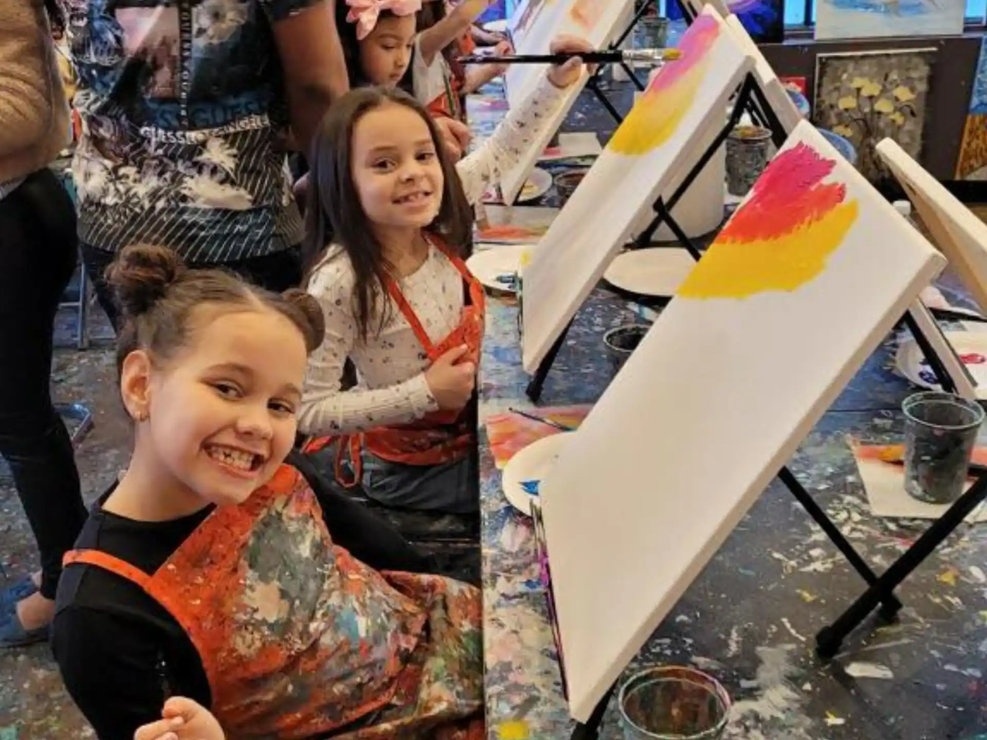 a group of children painting