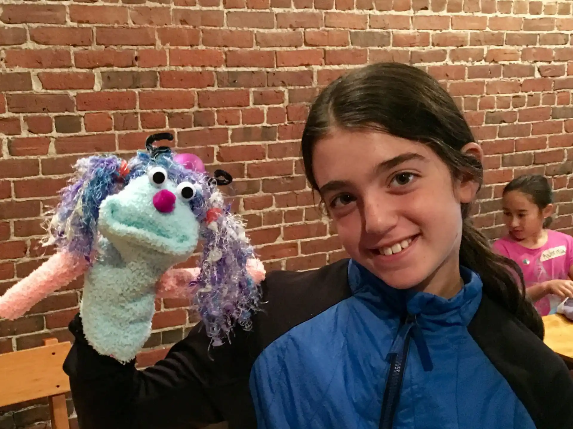a person holding a stuffed animal