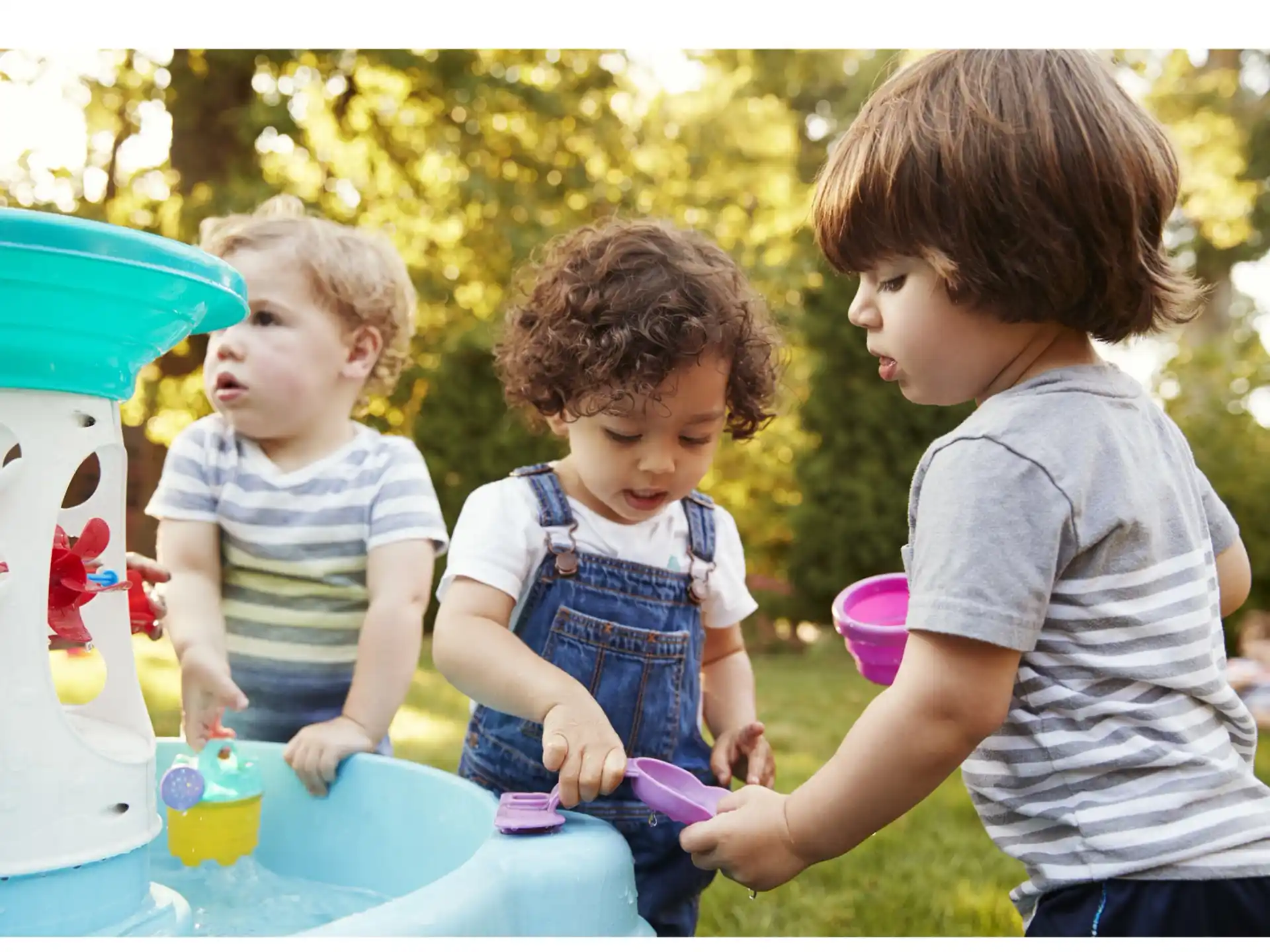 a group of kids playing with toys