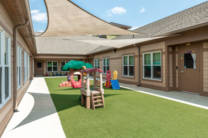 a small play set in a backyard