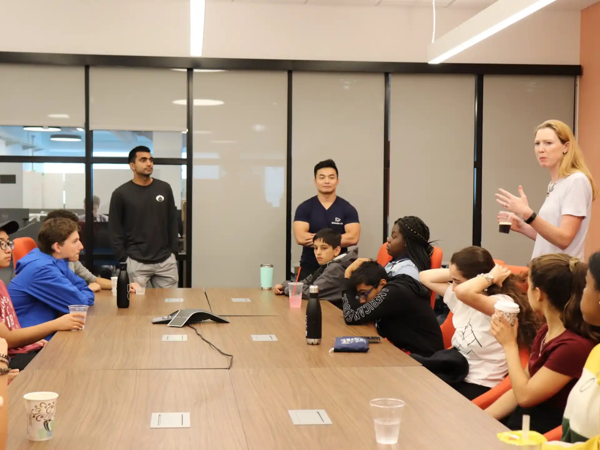 a group of people sitting around a table