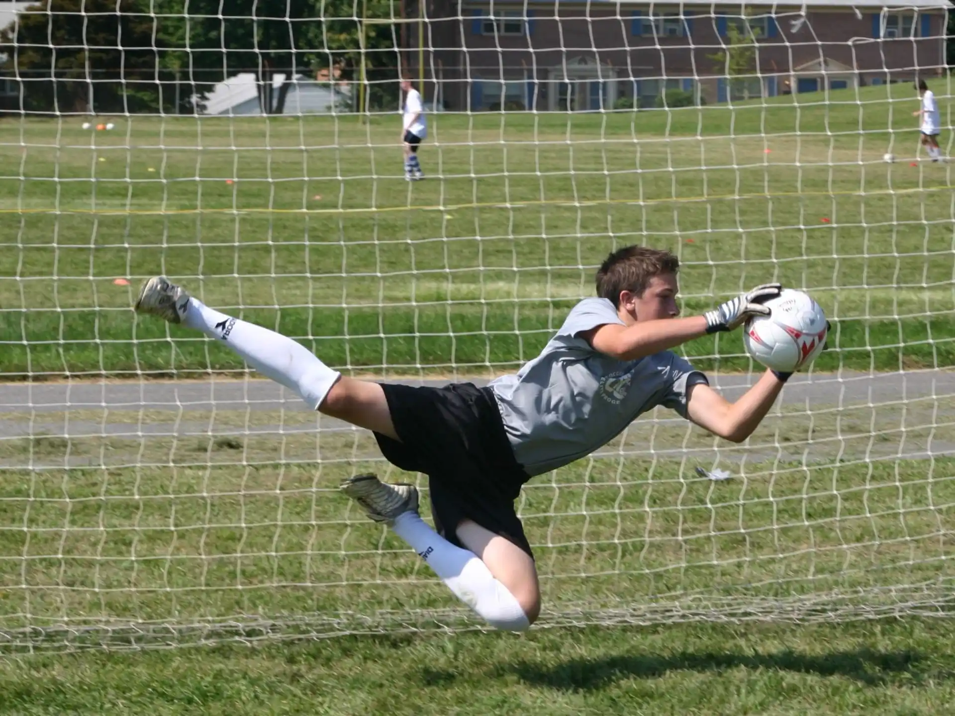 a person diving for a football ball