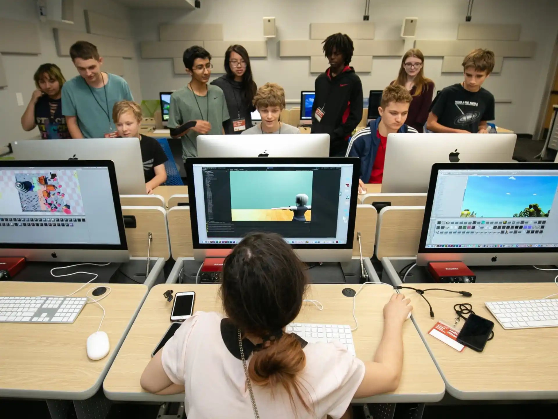 a group of people in a room with computers