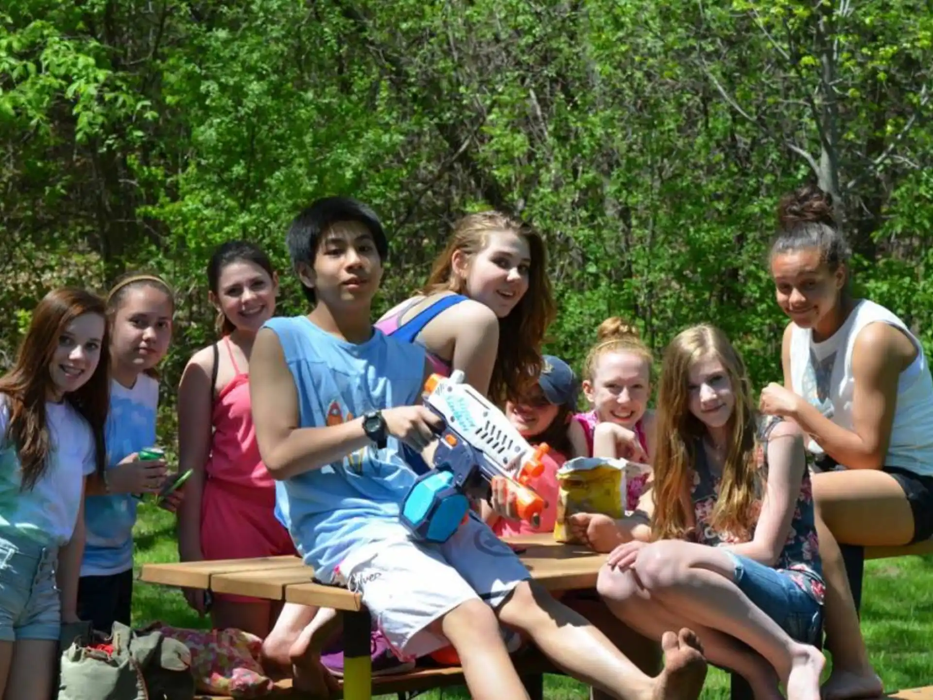 a group of people sitting together outside