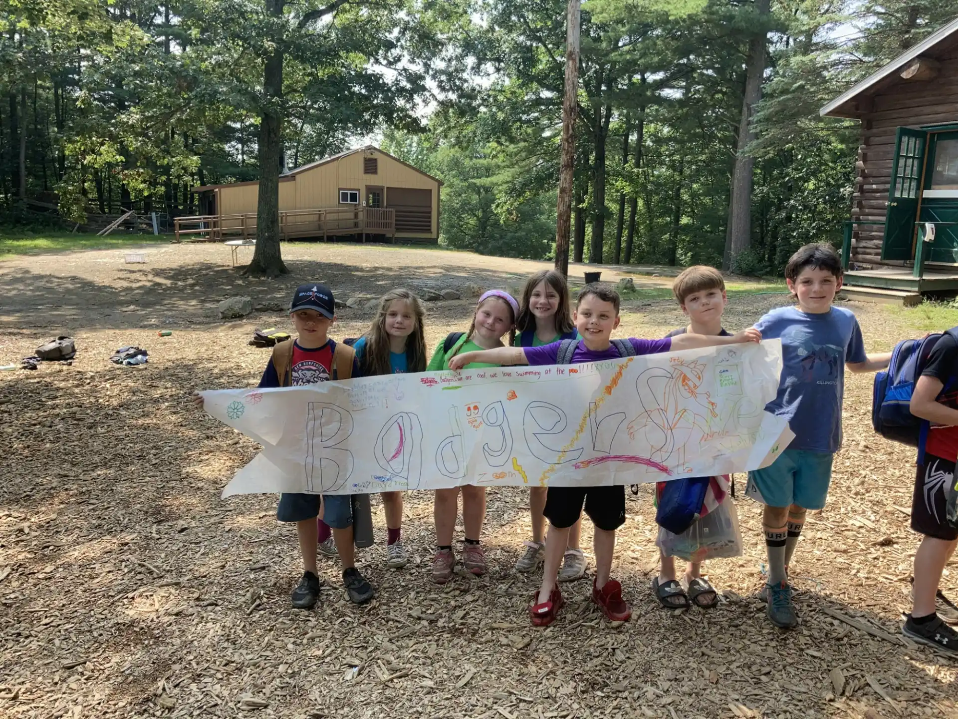 a group of children holding a banner