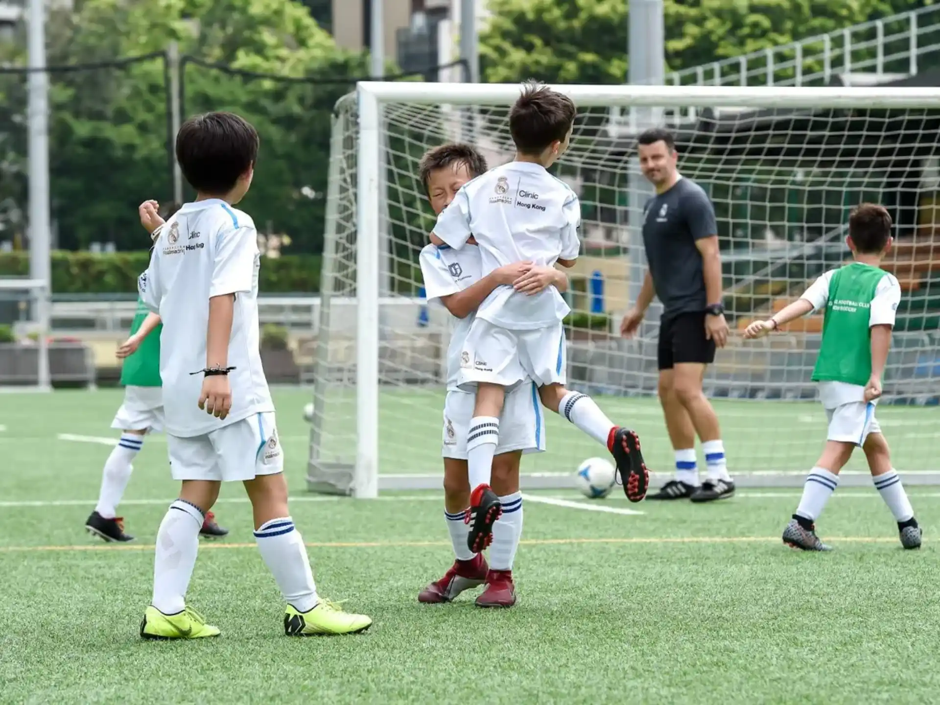 a group of kids playing football
