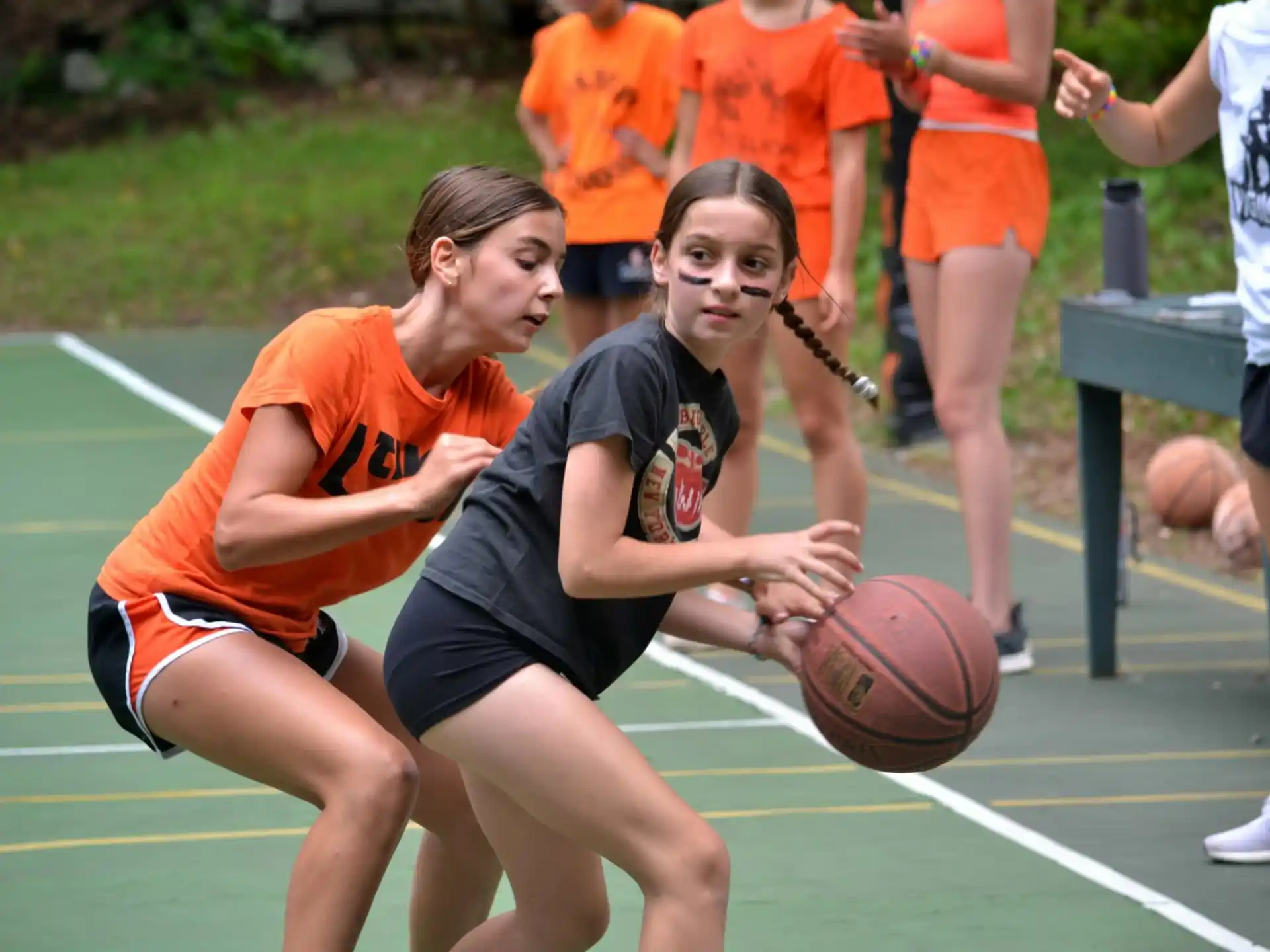 a couple of women playing basketball