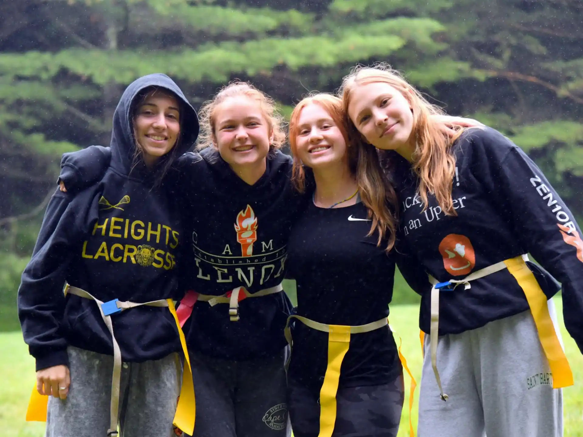a group of women in black and yellow clothes
