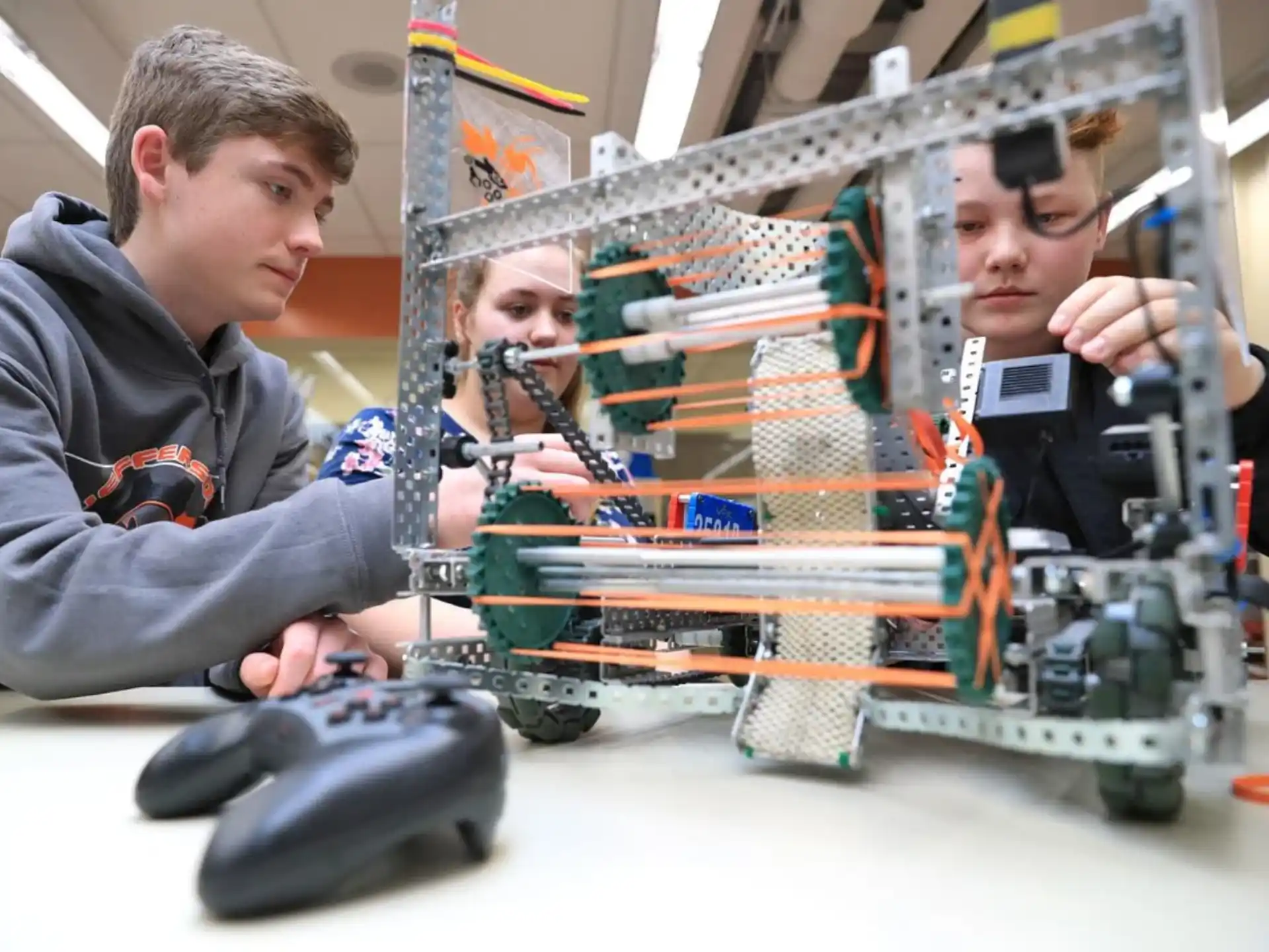 a group of people working on a machine