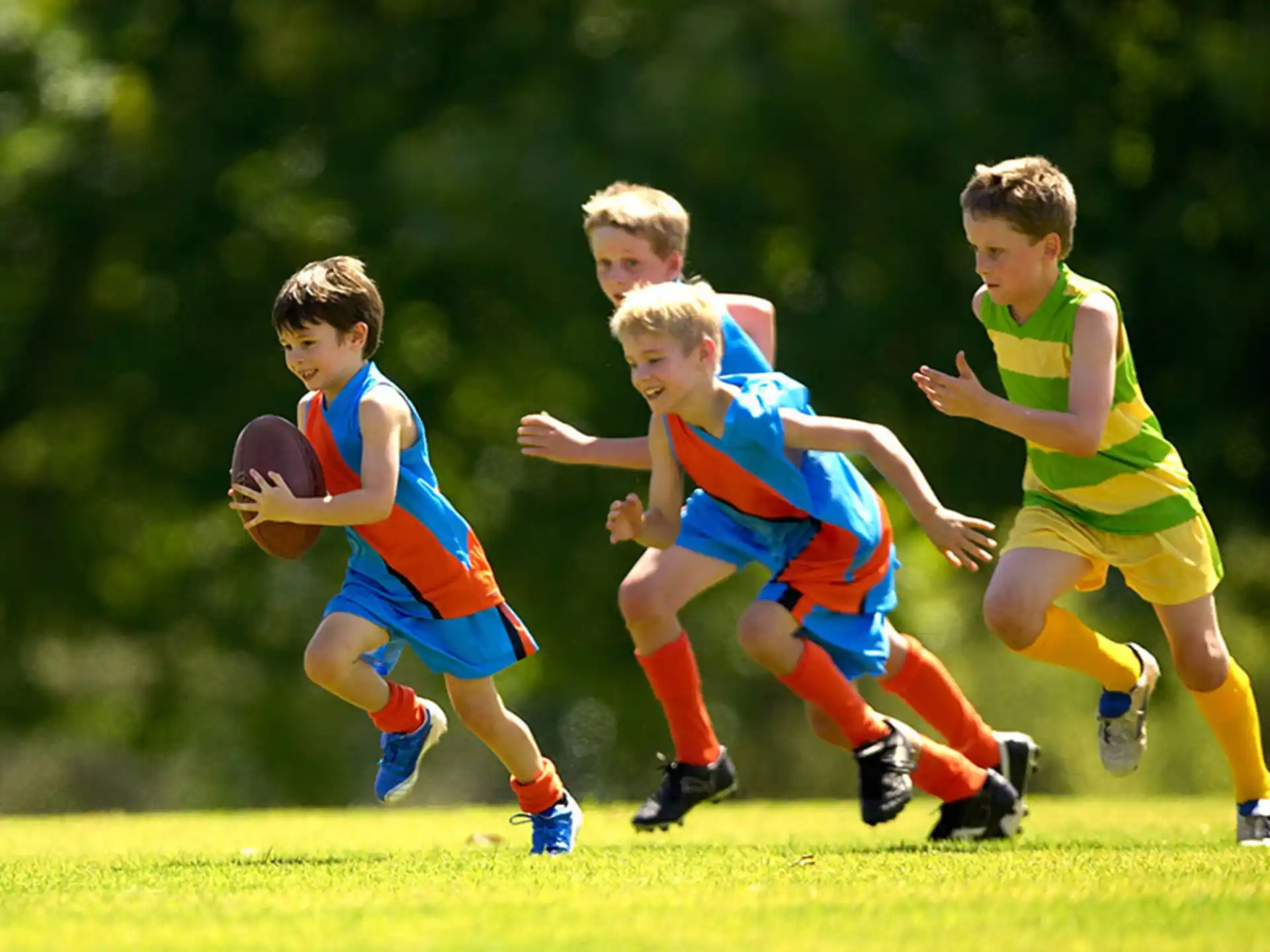 a group of boys playing rugby