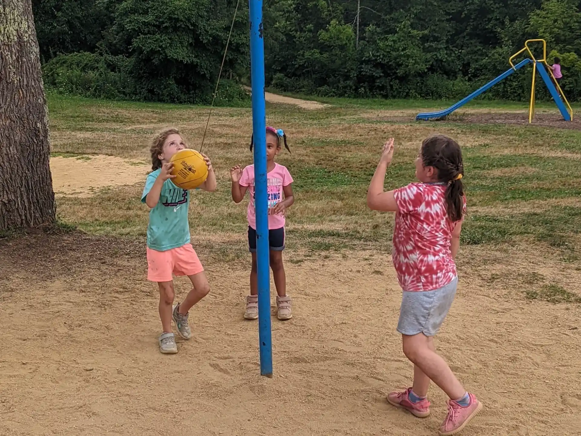 a group of children playing on a playground
