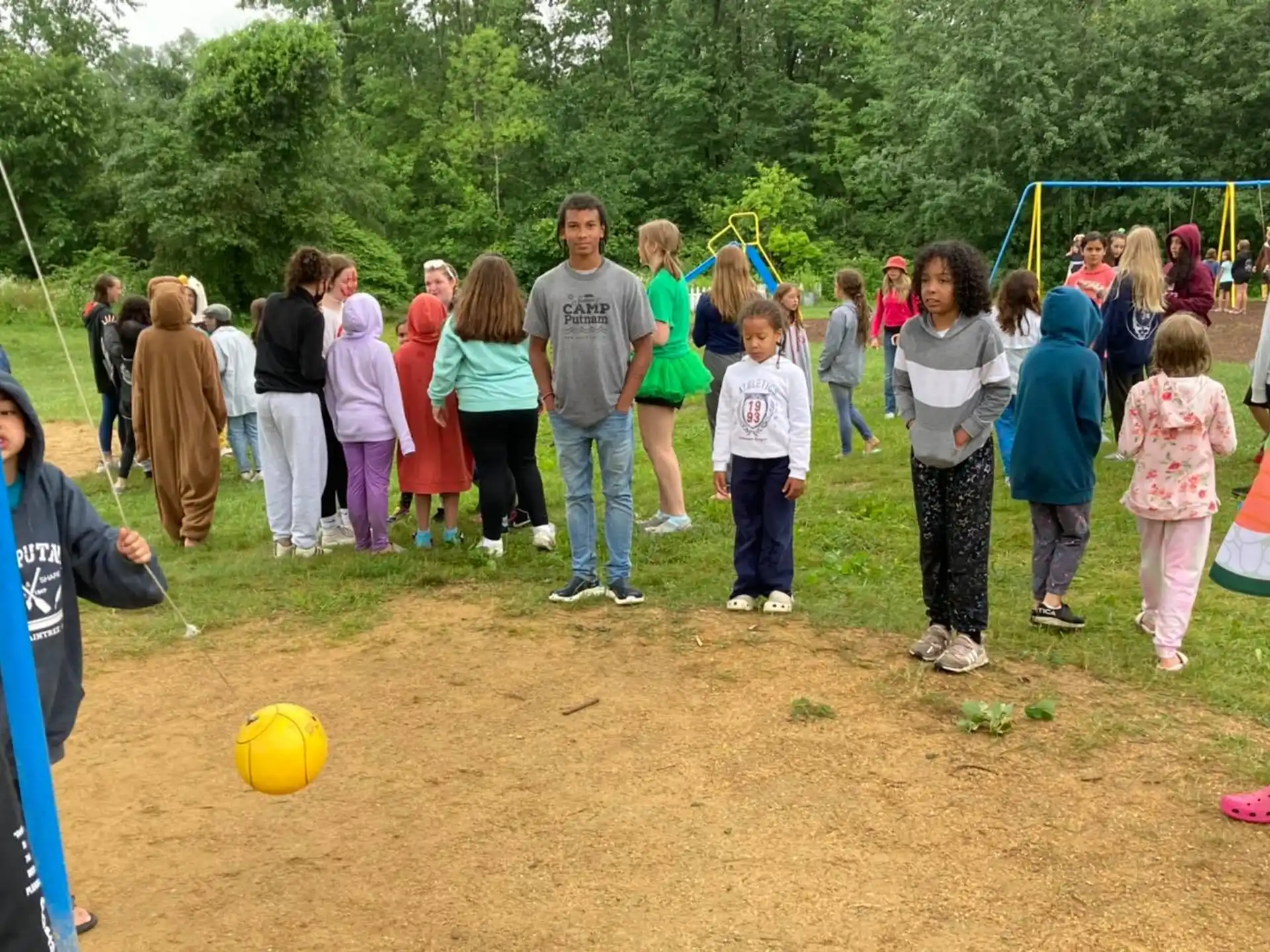 a group of people watching a person play football