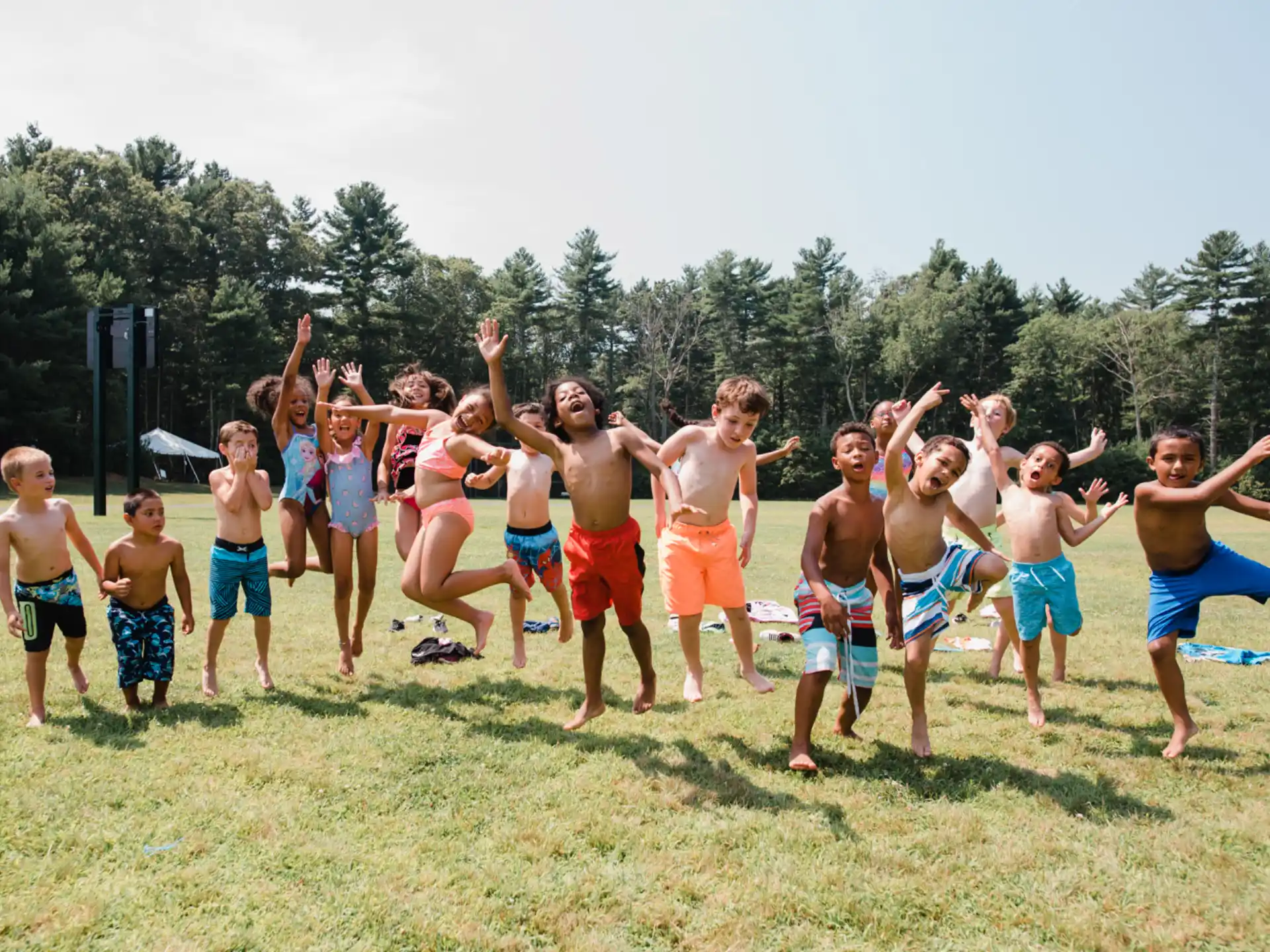 a group of boys jumping in the air