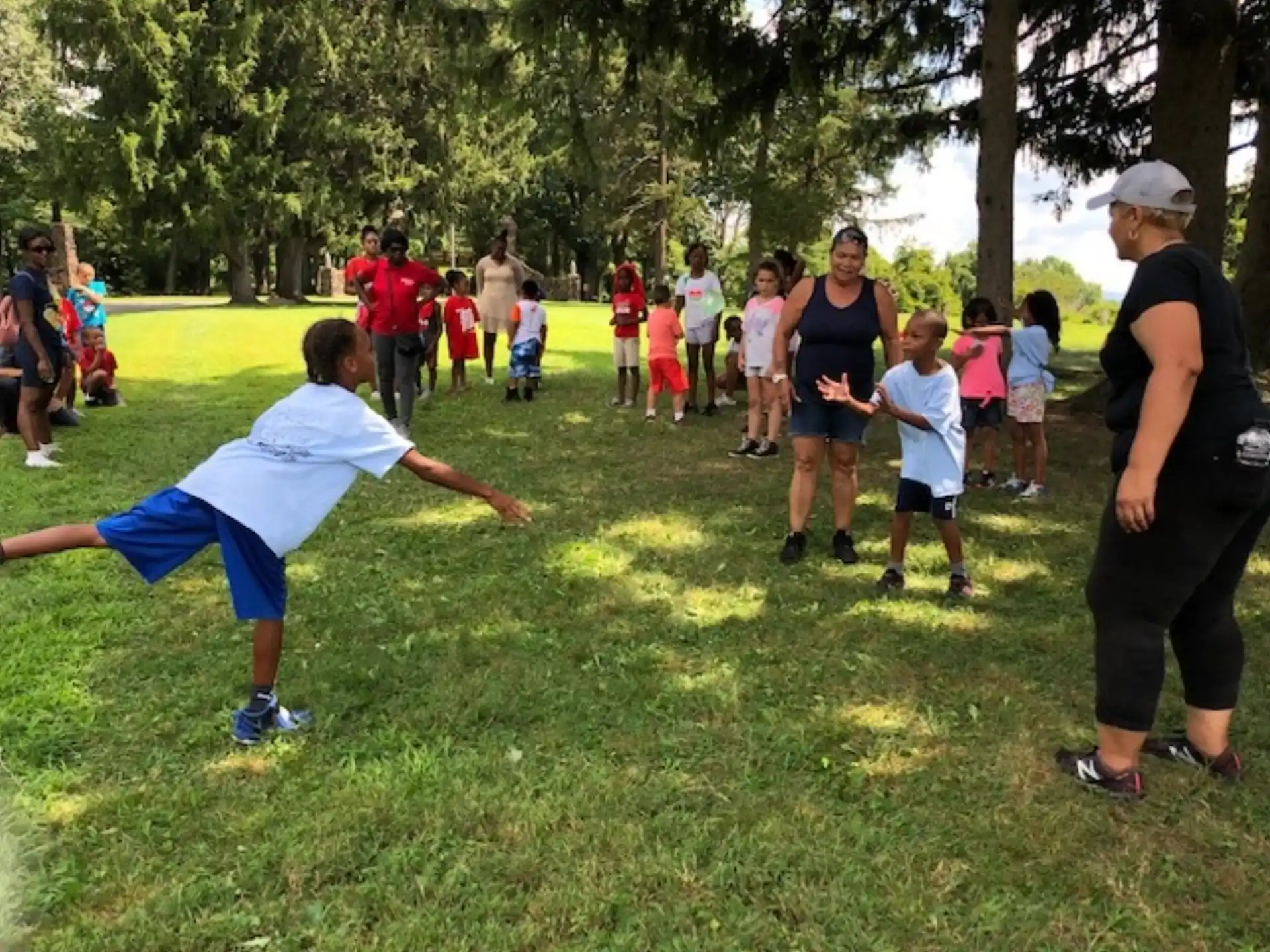 a group of people playing in a field