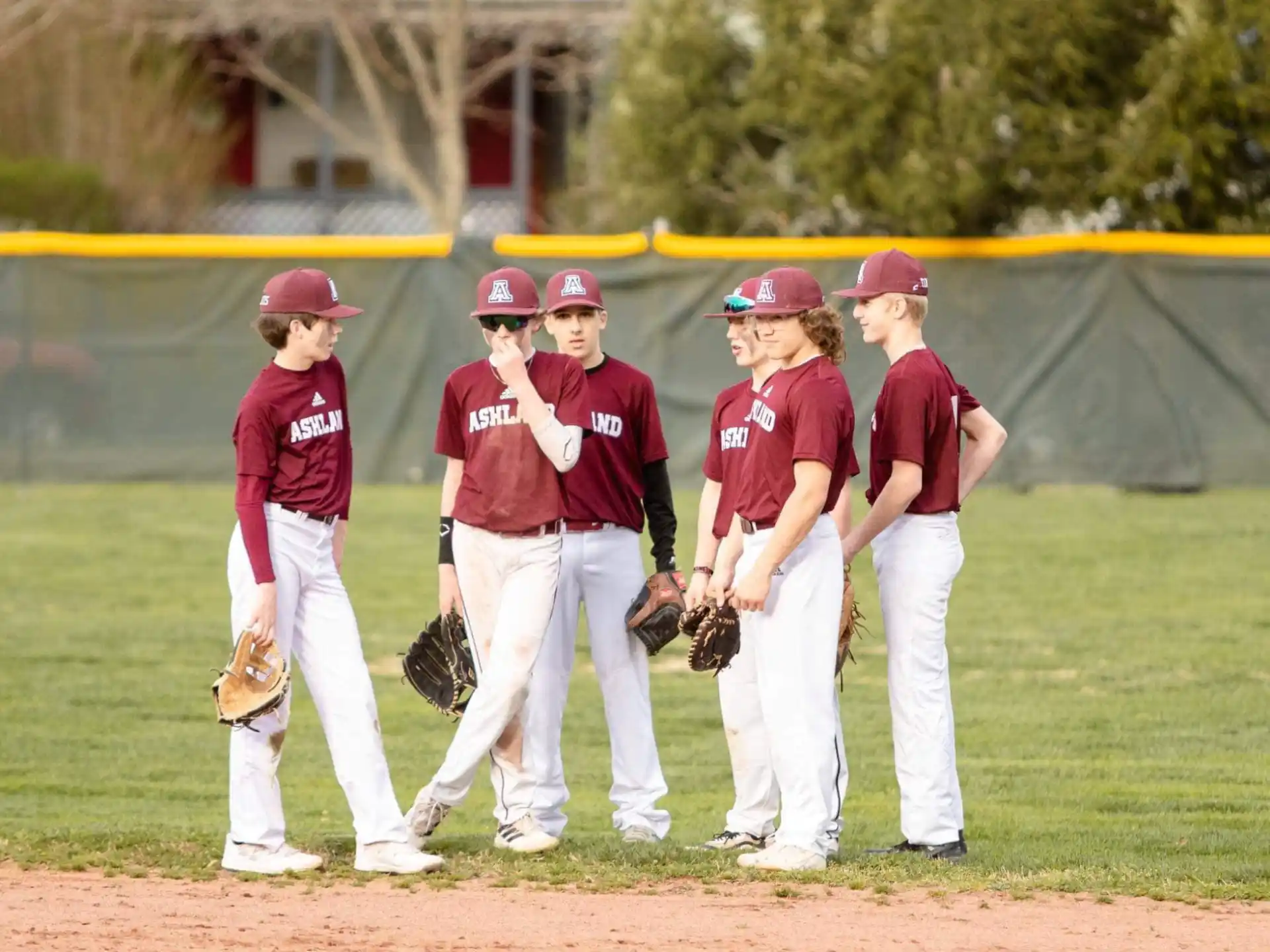 a group of baseball players pose for a photo