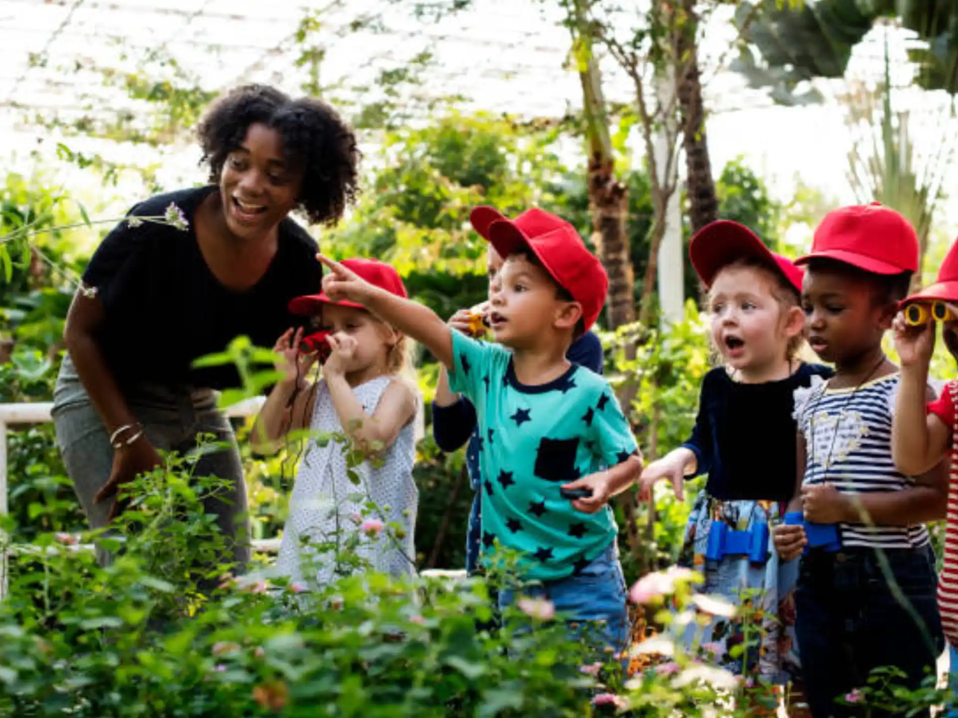 a group of people standing in a garden