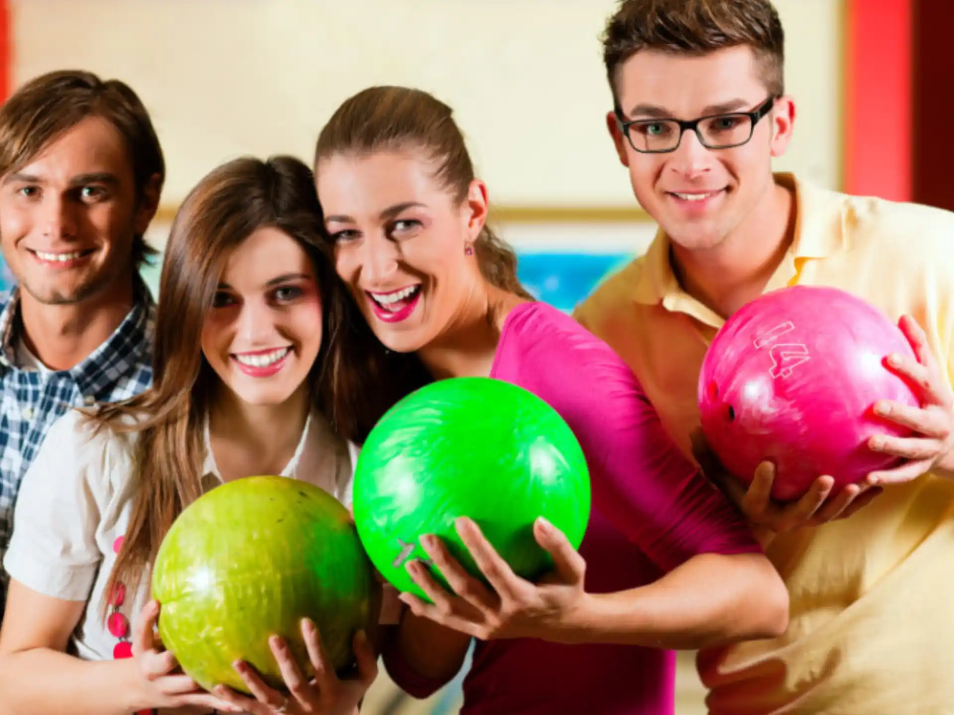 a group of people holding watermelons