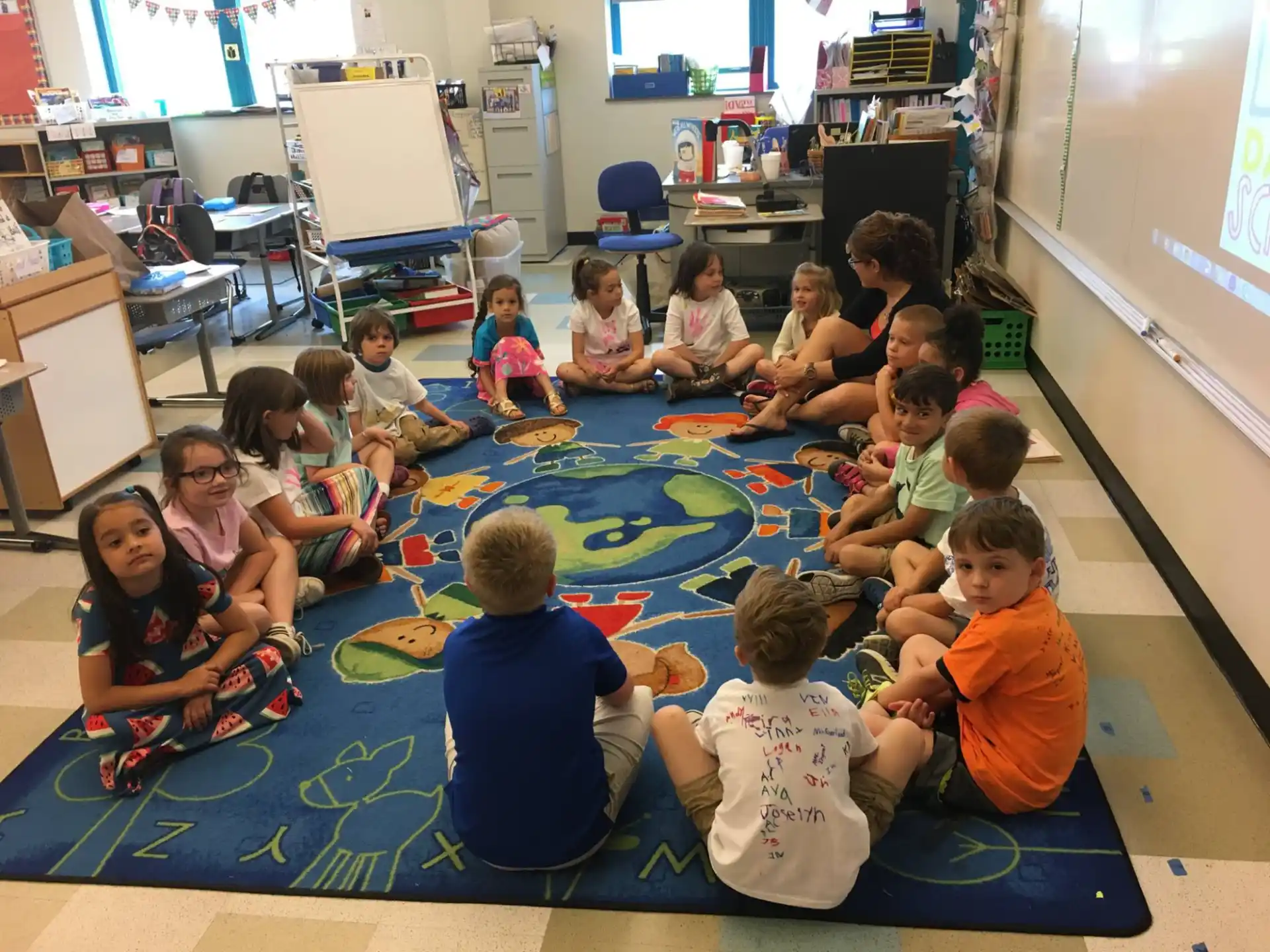 a group of children sitting on the floor