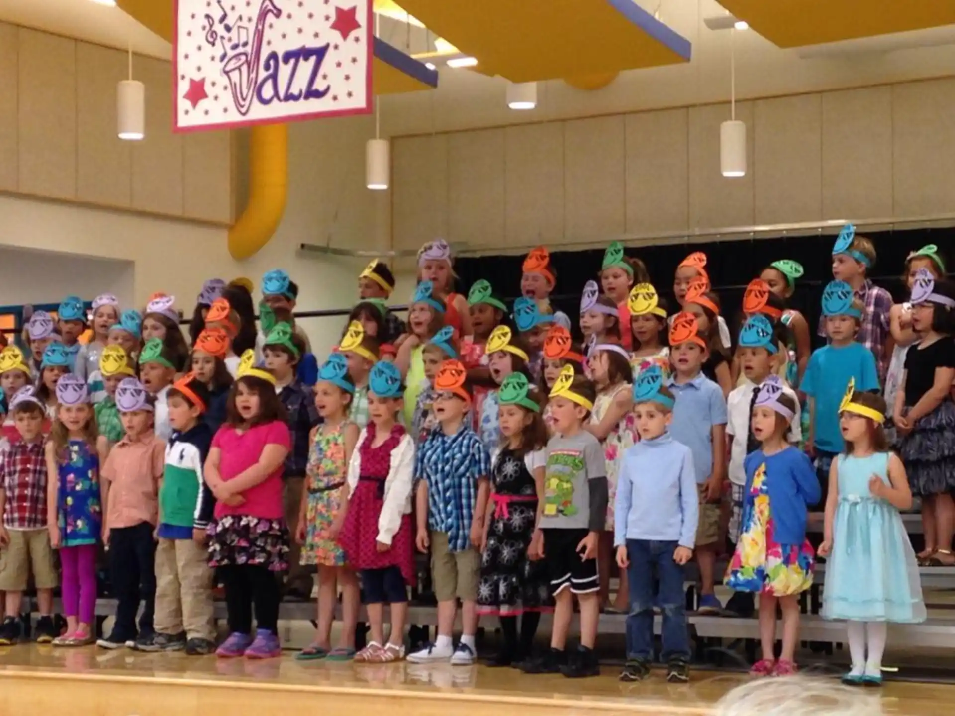 a group of children wearing party hats