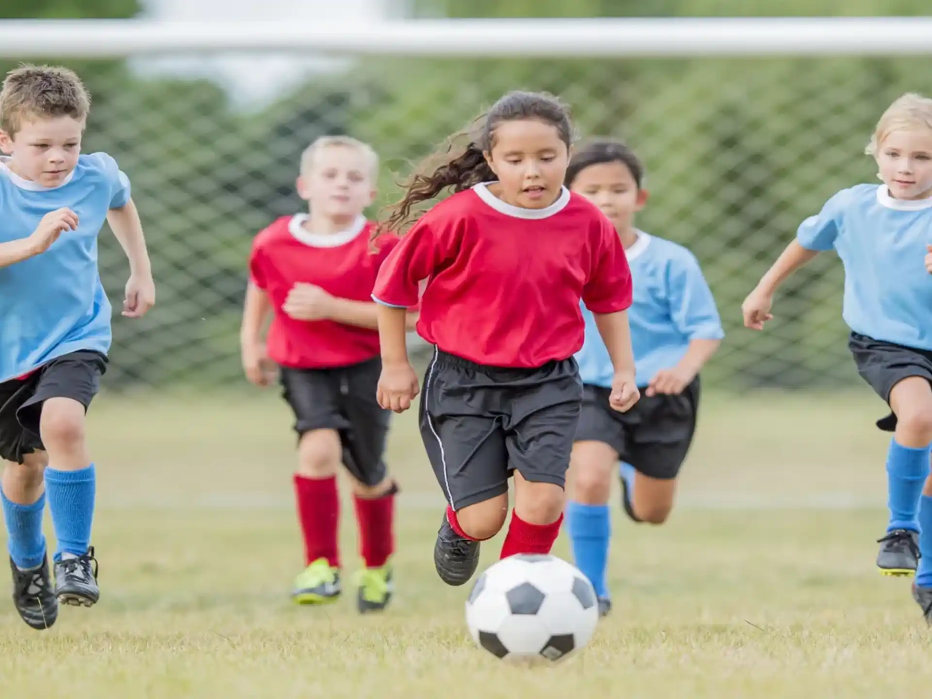 a group of kids playing football