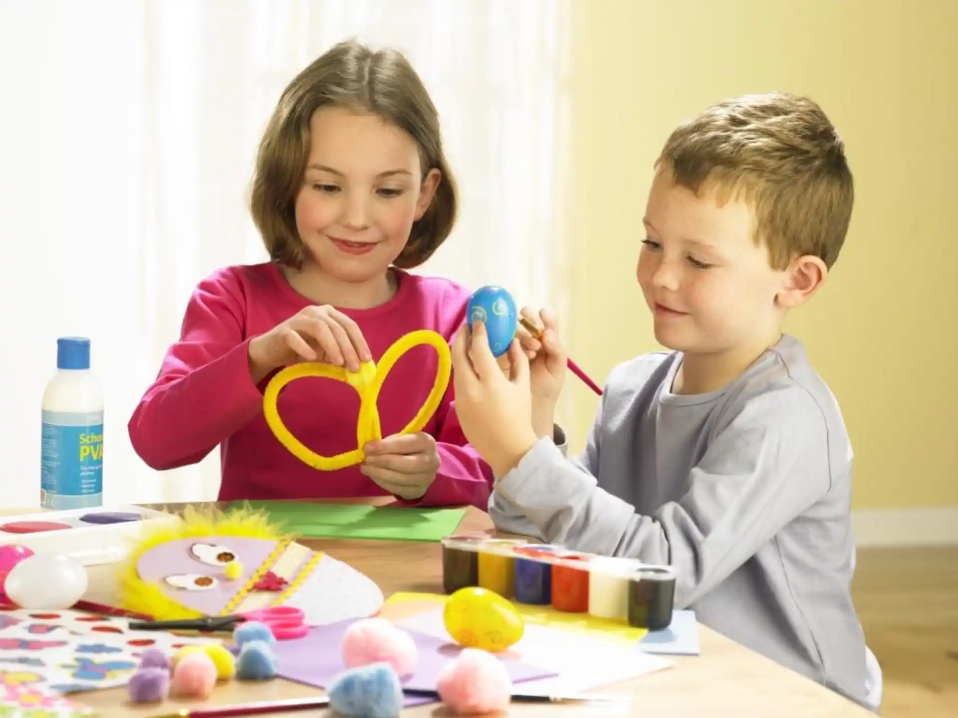 a boy and girl painting
