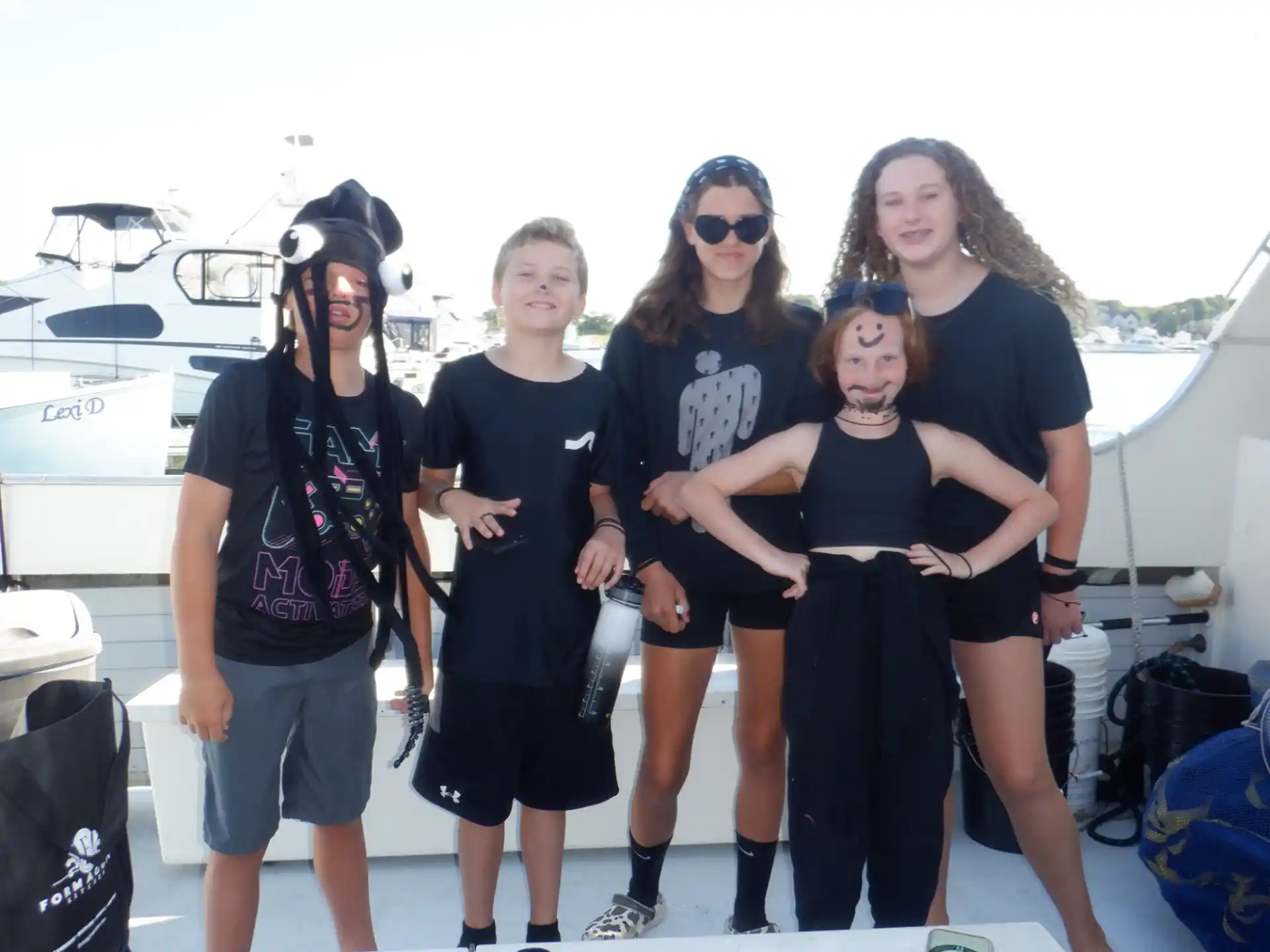 a group of people posing for a photo on a boat