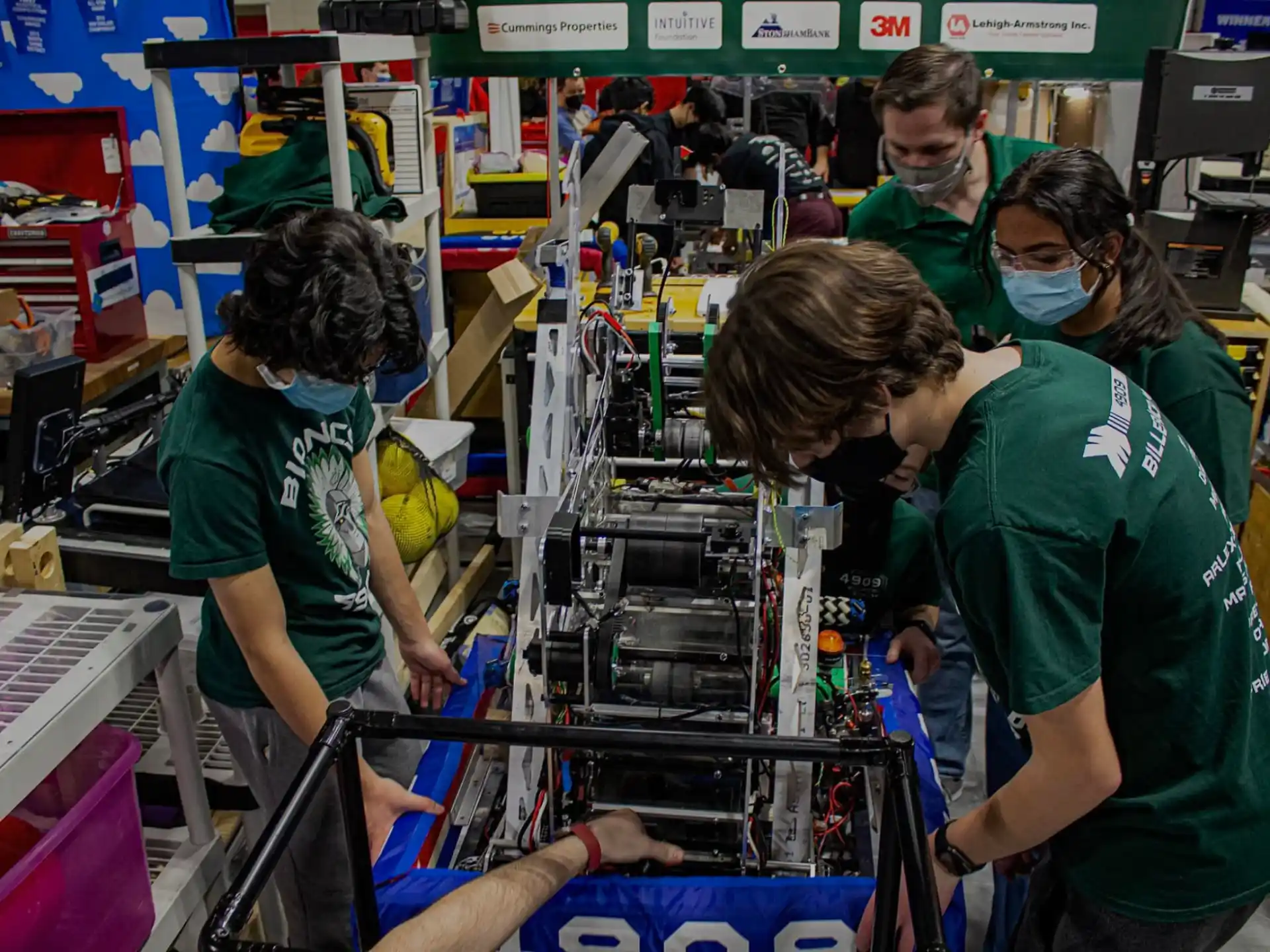 a group of people working on a machine