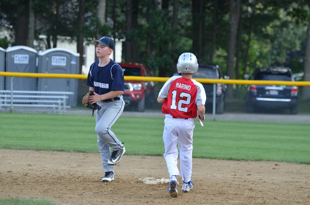 a couple of young boys playing baseball