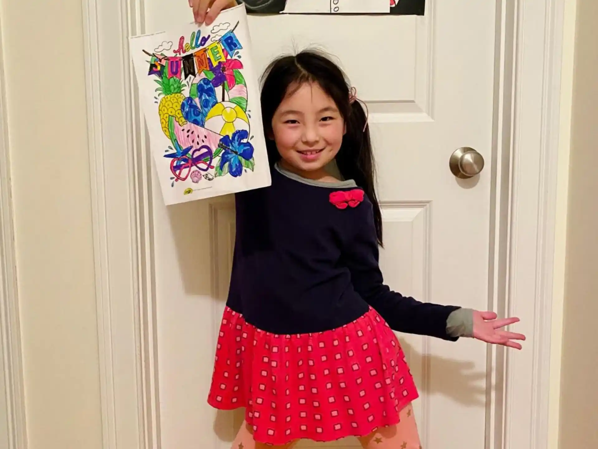 a girl holding a box