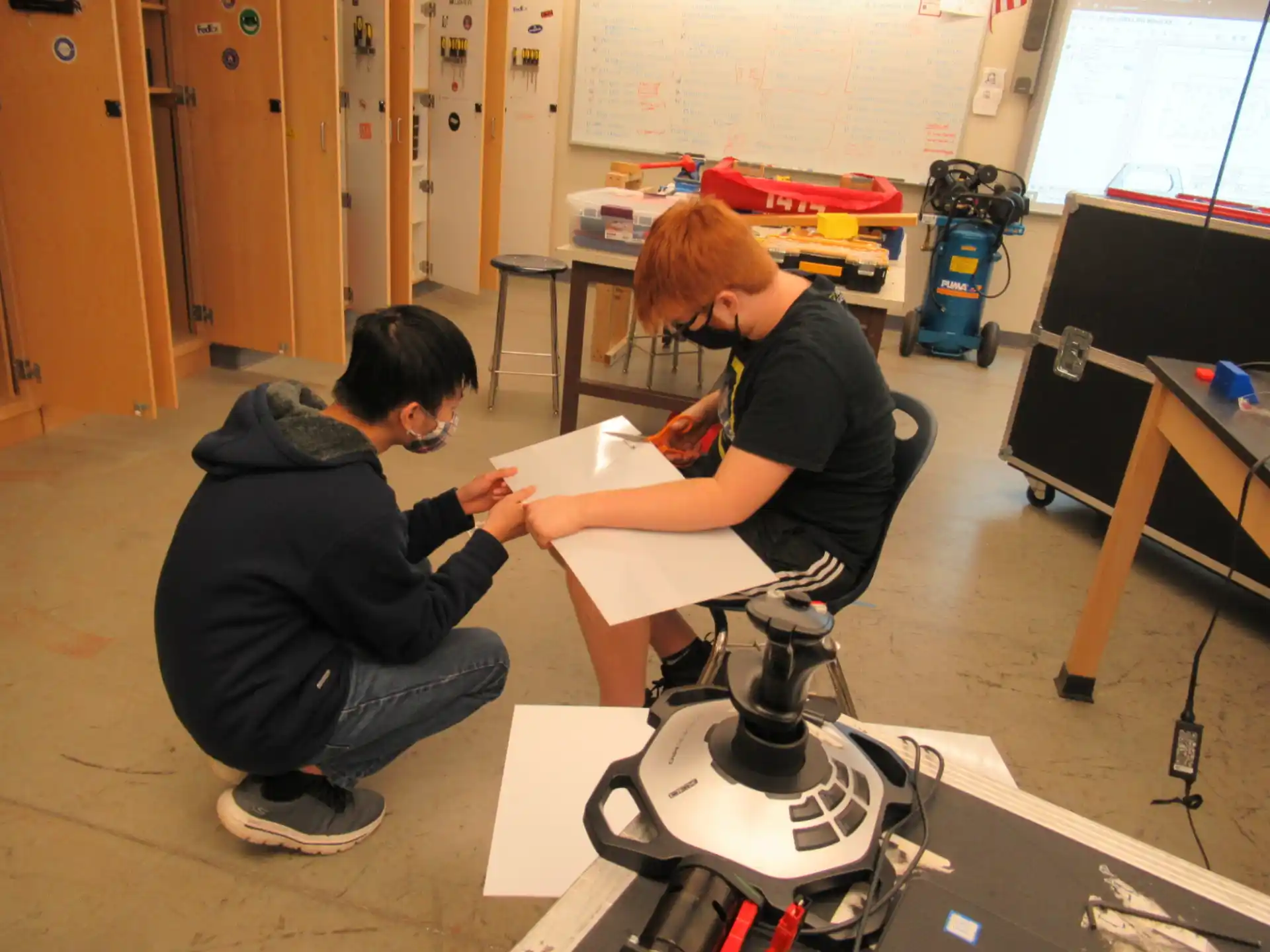 a couple of people working on a project