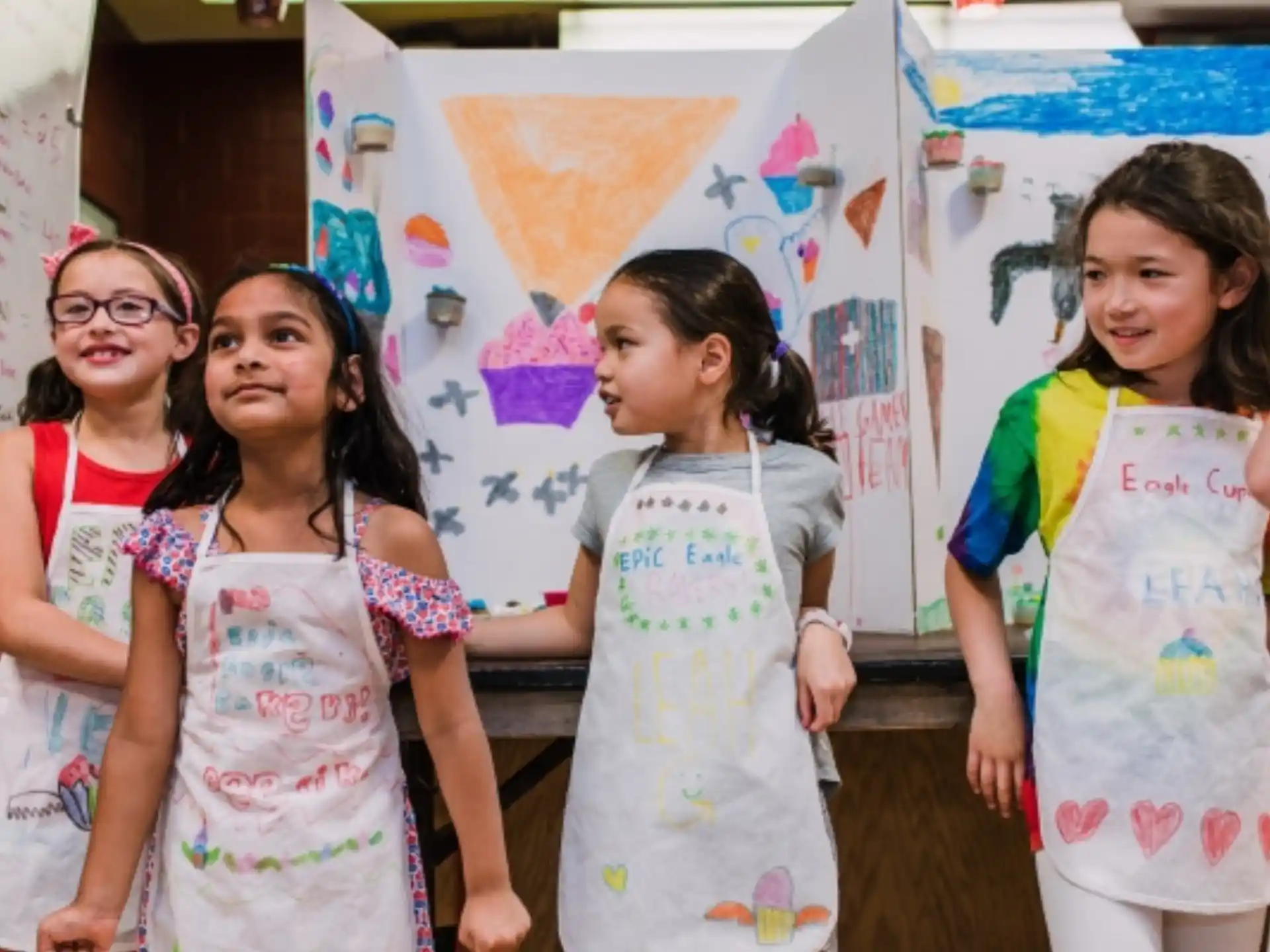 a group of girls in dresses