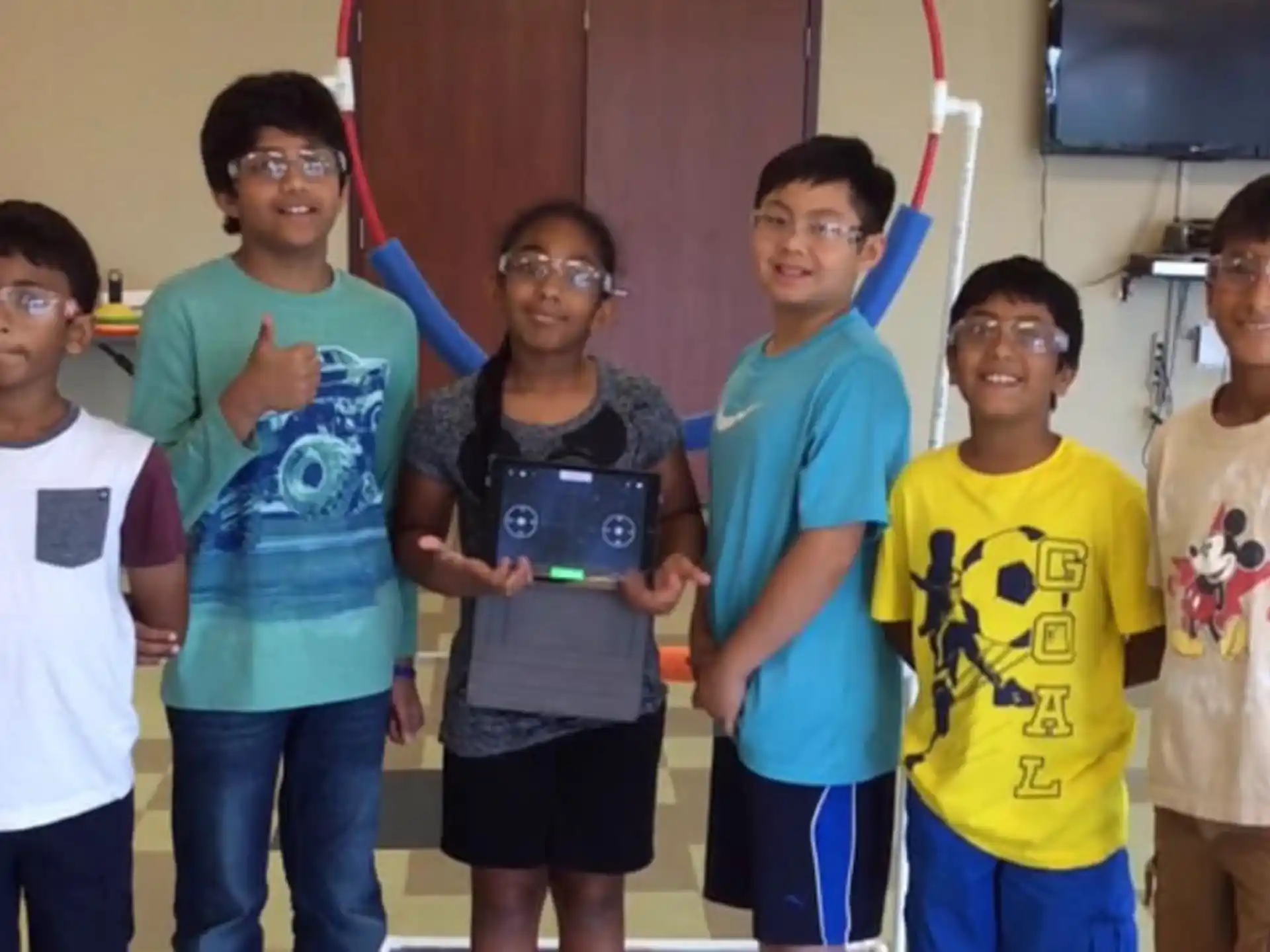 a group of kids wearing matching t-shirts
