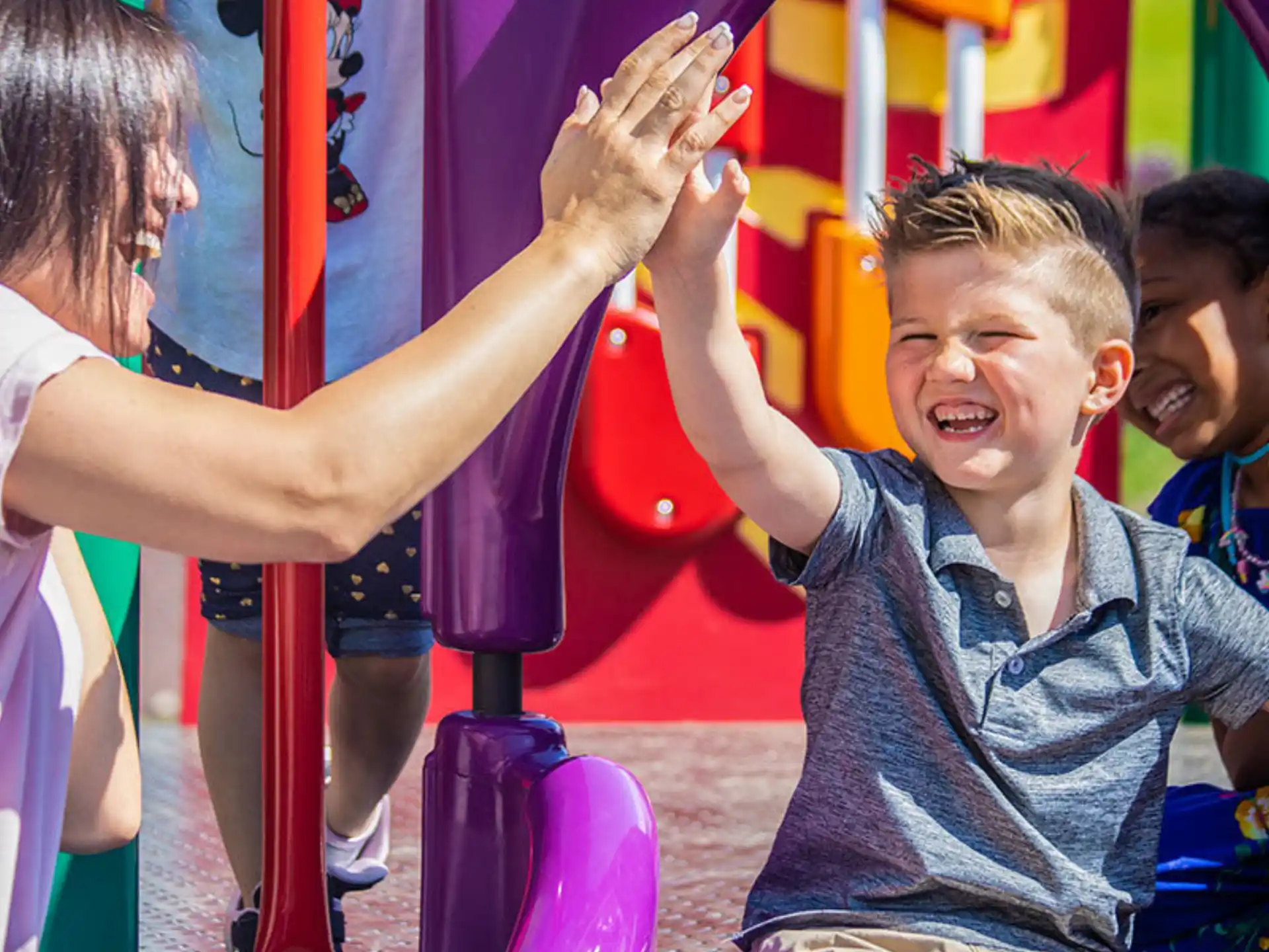 a boy playing on a playground