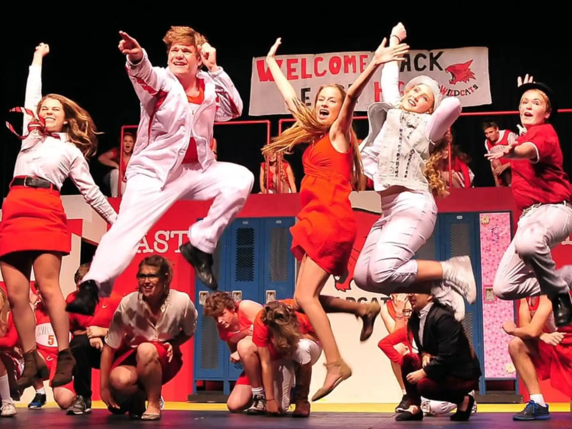a group of people jumping in the air