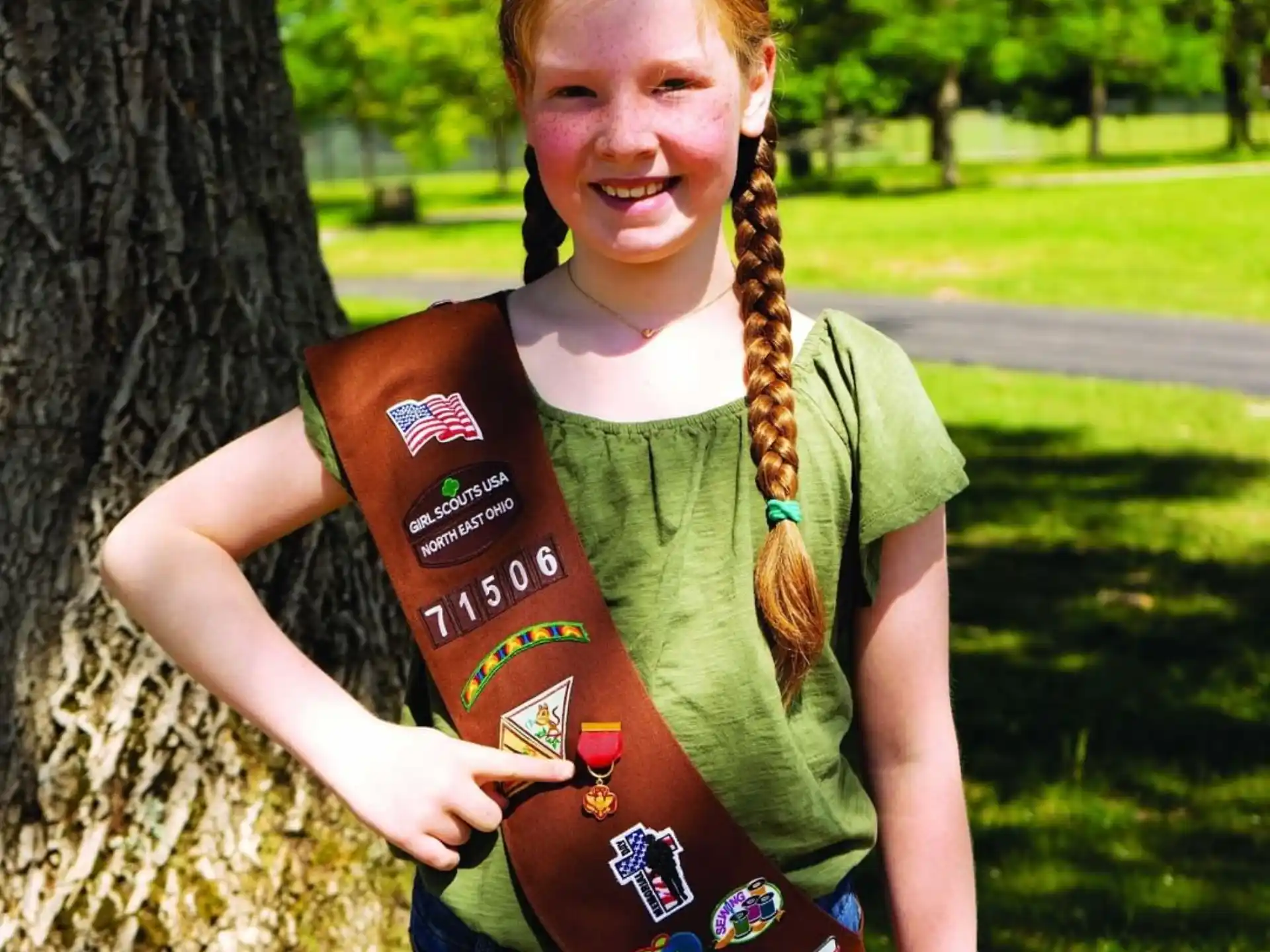 a girl holding a book