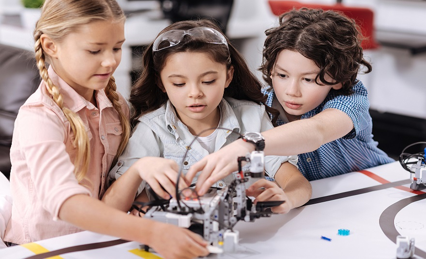 a group of young girls working on a project