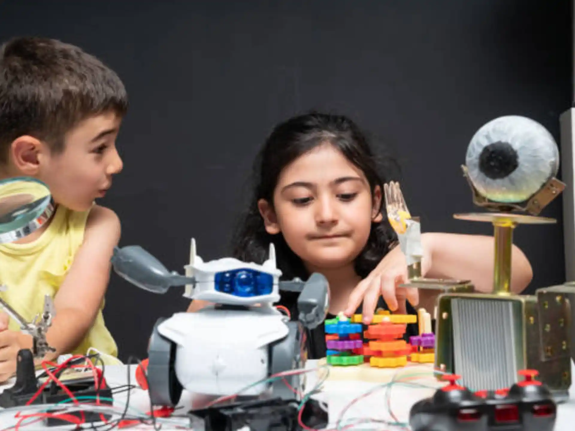 a person and a boy working on a project