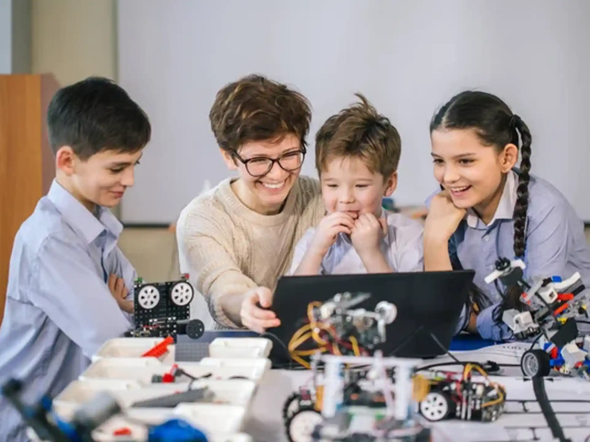 a group of people looking at a computer