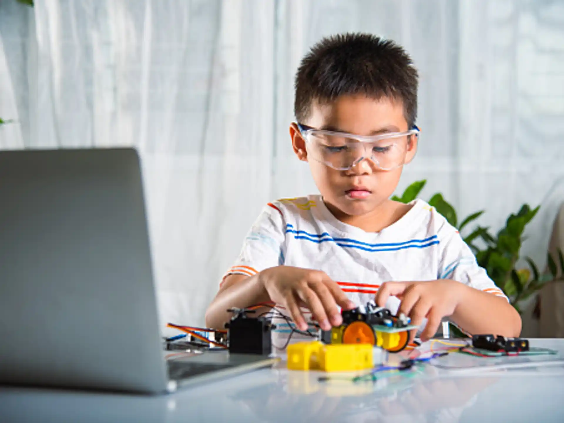 a boy using a laptop