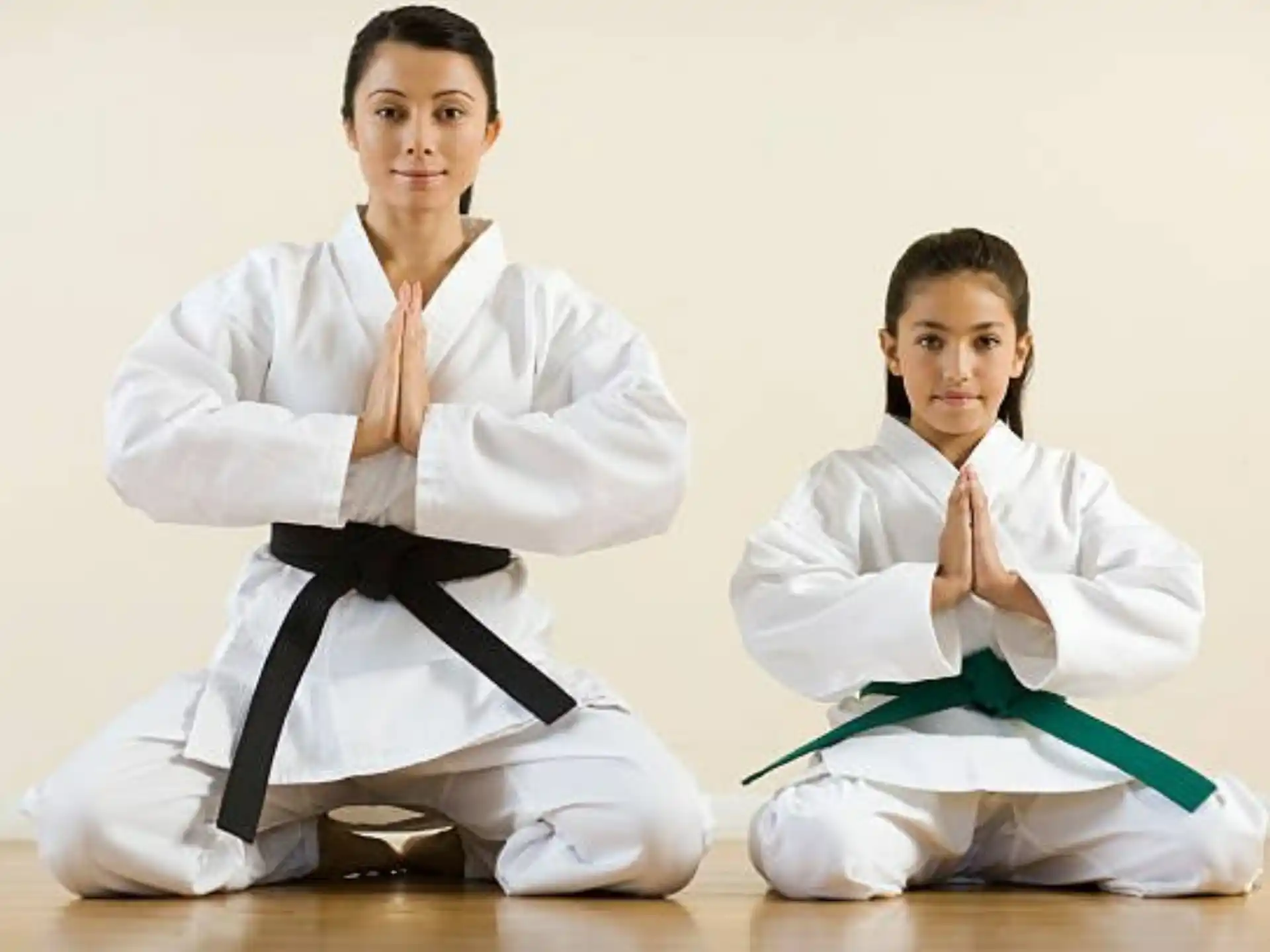 a couple of people in karate uniforms