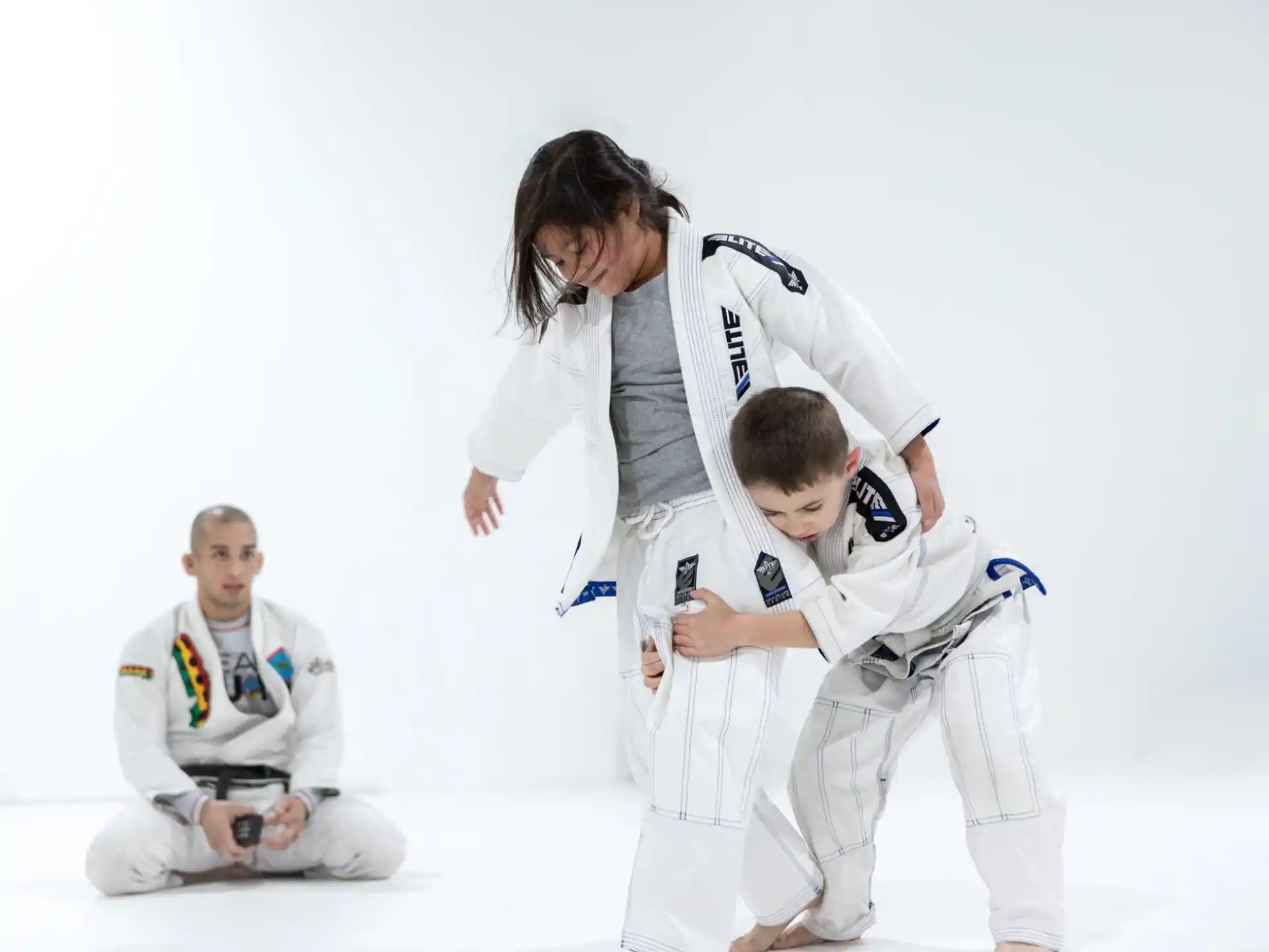 a group of people in karate uniforms