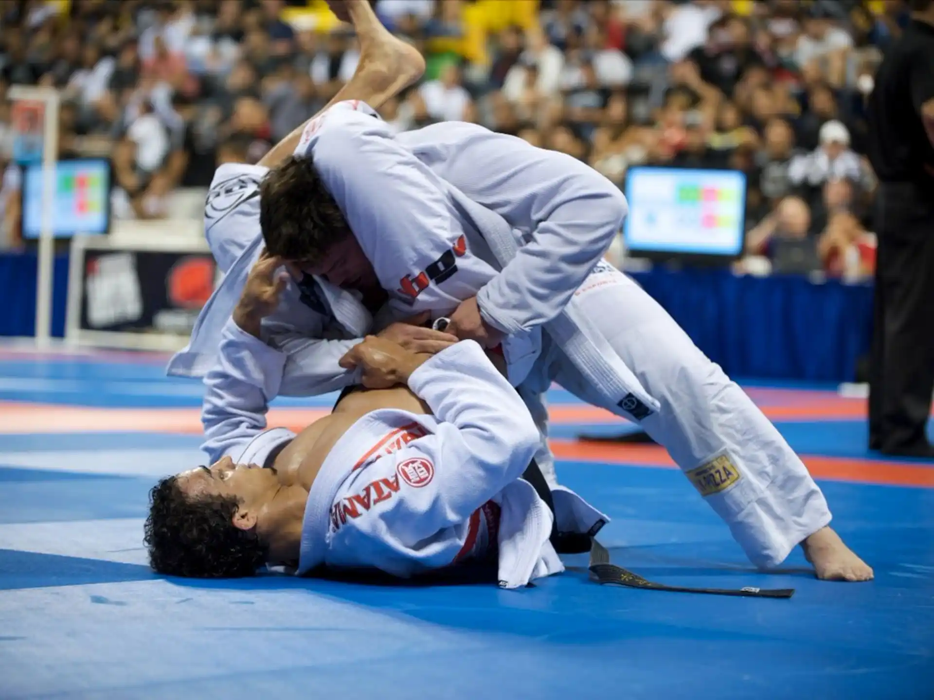 a man kicking another man