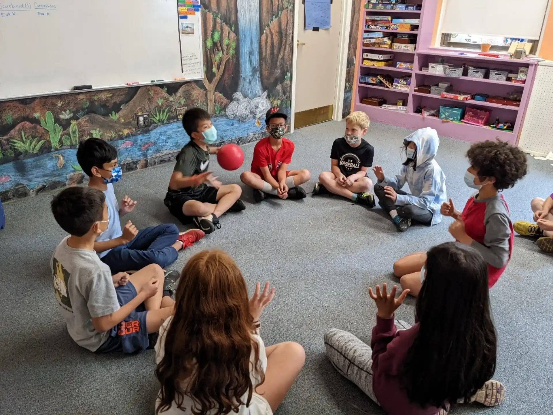 a group of children sitting on the floor