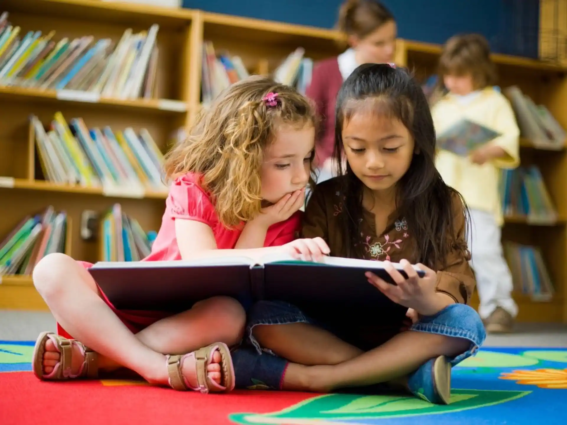 a few children reading a book