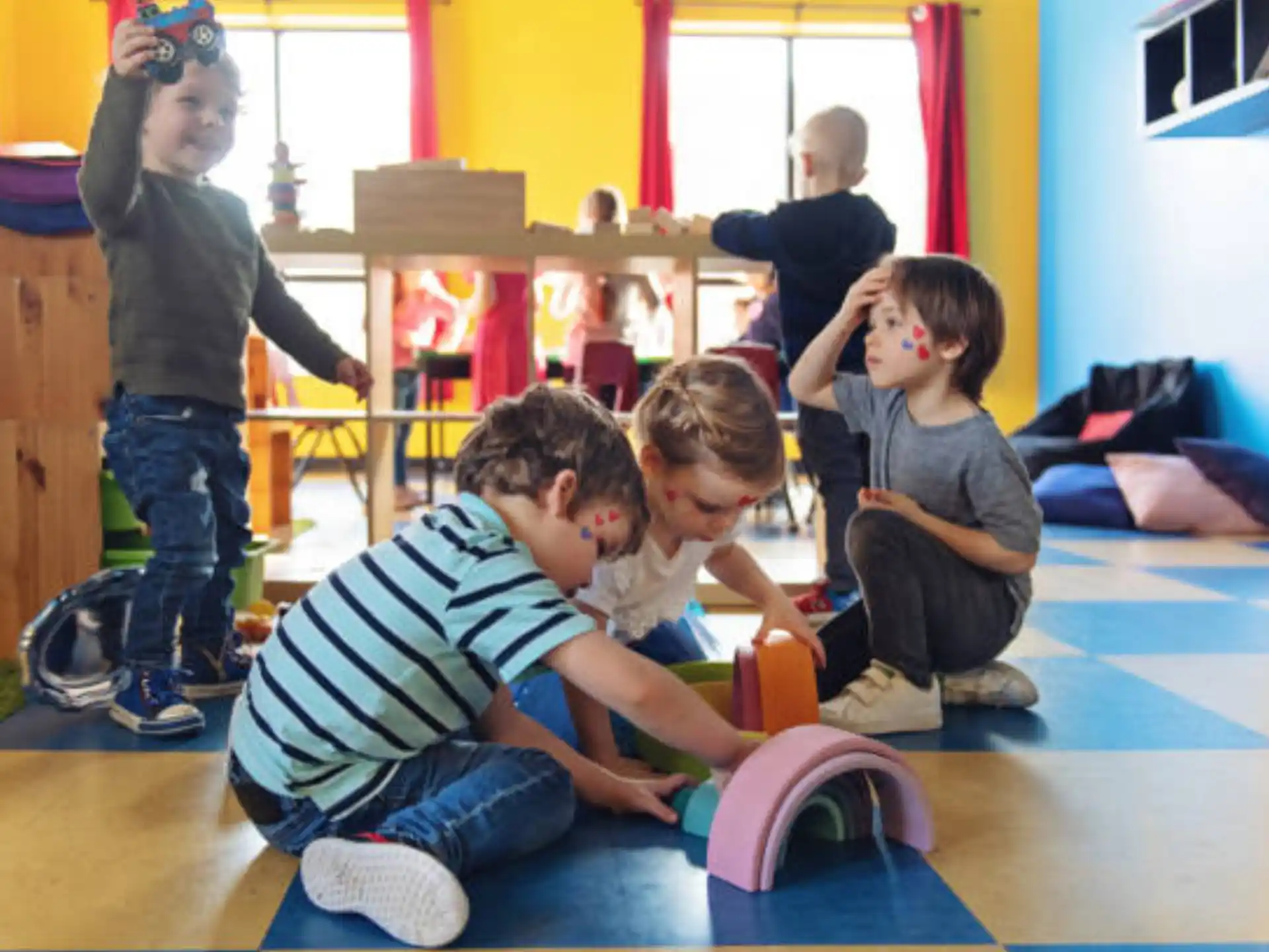 a group of kids playing with toys